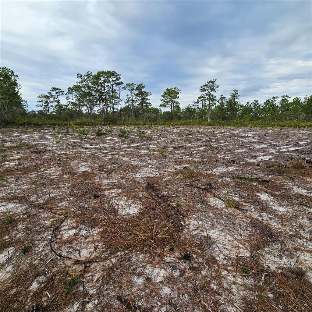 Photo of 108 El Dorado Dr, Indian Lake Estates, FL 33855 (MLS # S5140357)