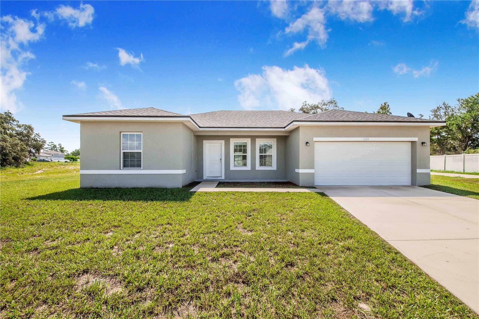 Beautiful Move-in-ready NEWER, FULLY TILED FLOORS 4 bedroom, 2 bathroom, single-family home located in Poinciana. Once inside you're greeted with a spacious open concept family room that opens to the modern kitchen with dining area and beautiful large serving island/breakfast bar. The kitchen boasts plenty of cabinets perfect for that home chef. The primary suite with private bathroom offers dual sinks, walk-in closet, and a walk-in tiled shower. Back sliding door leads out to a paved patio which overlooks the ample, semi-private backyard. This home has a 2-car garage, and is conveniently located to parks, sports courts, multiple playgrounds, conservation areas, theme parks, shopping centers, medical, and restaurants.