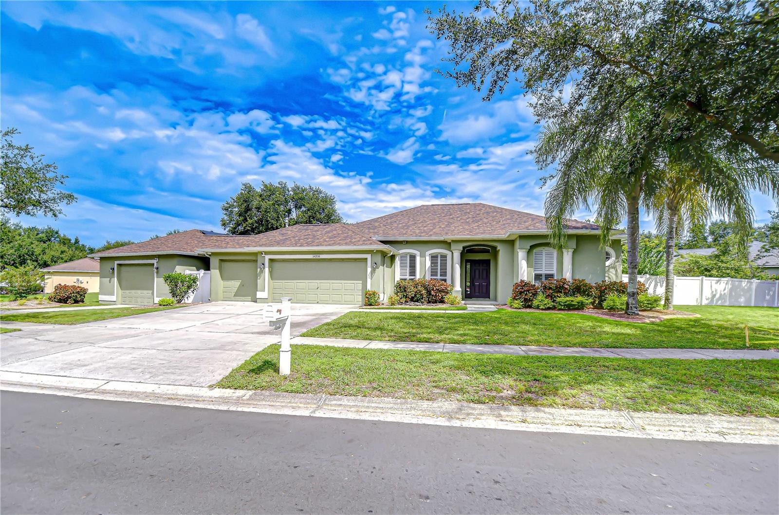 Welcome to Creekside—a beautiful, mature, gated community with no CDD fees! This move-in ready home combines modern updates, energy efficiency, and incredible outdoor living on a fully fenced .54-acre lot. Featuring 4 bedrooms, 2.5 bathrooms, and an oversized garage setup, this home has been thoughtfully upgraded inside and out. Major improvements include: a new roof (2022), remodeled bathrooms (2023), a fully renovated kitchen with granite countertops, modern gray cabinetry, and stainless steel appliances (2023), fresh interior paint, and a new well water tank (2024). Energy-conscious buyers will appreciate the paid-off solar panels, offering both sustainability and long-term savings. Inside, wood-look ceramic tile flows through the main living areas, complemented by abundant natural light and serene backyard views. The formal living and dining rooms provide a welcoming entry, while the remodeled kitchen serves as the heart of the home—complete with bar seating, granite counters, and generous storage. The adjoining family room creates the perfect space for entertaining and everyday living. The private primary suite offers a peaceful retreat with an en-suite bath featuring a garden tub and dual sink vanity. Two bedrooms share a full bath and direct lanai access, while the fourth bedroom provides excellent flexibility as a guest room, office, playroom, or media room. Step outside to your private backyard oasis—a 22x14 saltwater pool with 9-foot depth and dual 10-foot sun shelves awaits, surrounded by plenty of space for outdoor fun. And just when you think you’ve seen it all, this home reveals its hidden gem: a detached 24x40 garage, connected by a short covered walkway. With both front and rear access, this versatile space goes beyond storage. Outfitted with a half bath, bar, and custom cabinetry, it’s the ultimate man cave, workshop, or hobbyist’s retreat. Paired with a 16x16 concrete shed and a 10x14 lawn shed, you’ll have room for every project, passion, and pastime. This home truly offers it all—modern upgrades, energy efficiency, and resort-style outdoor living—all in a quiet gated community with no CDD fees! Copy and paste this link to tour the home virtually: my.matterport.com/show/?m=N17FAZfQYyK&mls=1