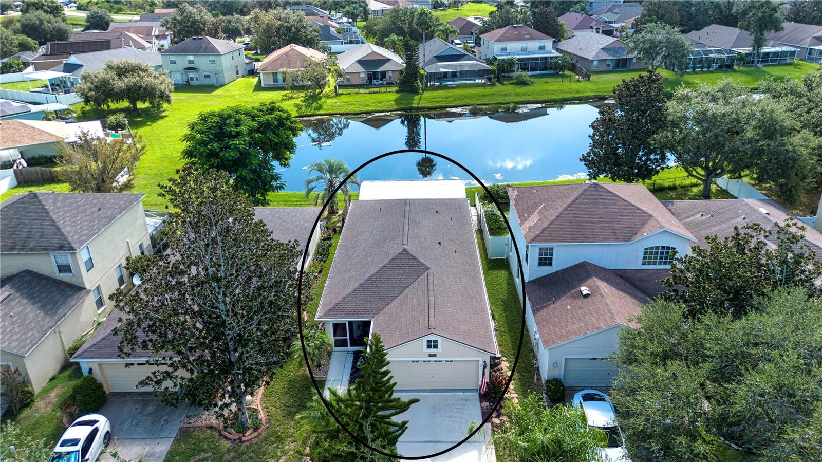 One or more photo(s) has been virtually staged. The original owners are selling their well maintained and updated home with a great pond view. The home includes hurricane high impact windows and patio sliding door 2018, roof 2018, gutters, fenced backyard, fresh paint inside including garage, updated kitchen cabinets, under counter lighting, back splash with granite countertop, and stainless-steel appliances. The kitchen includes a laundry closet and large pantry. The kitchen has a view out to pond and very large patio. The primary bedroom is separate from other bedrooms for privacy. The area has been updated with new flooring, shelving in walk in closet, and has a totally updated bathroom with tile shower and dual sinks. The tax record lists home as four bedrooms, however, one is currently being used as an office and could be used as a flex room. The separate hallway leads to bedrooms, second bathroom with tub/shower and garage. The two-car garage has extra insulation in ceiling as recommended by electric company to save energy. This home is move in ready and waiting for you.