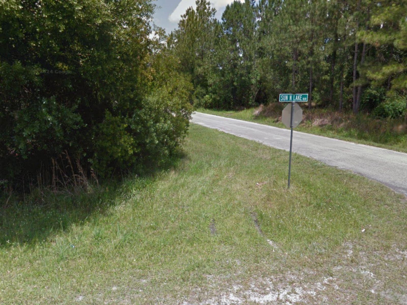 Corner lot opportunity in the desirable community of Sun ’N Lake of Sebring! This oversized 0.30 acre (13,256 sq ft) parcel is larger than most lots in the area (typically 0.23 acre) and offers 100 feet of frontage directly on Sun ’N Lake Boulevard. With its corner location and paved road access, the property provides excellent visibility and flexibility for your future home design. Public water and electricity are available nearby (septic required). Sun ’N Lake features two golf courses, clubhouse, recreation facilities, and parks. Conveniently located near Sebring International Raceway, medical centers, schools, and shopping. Whether you’re ready to build now or hold as an investment, this premium lot stands out from the rest!