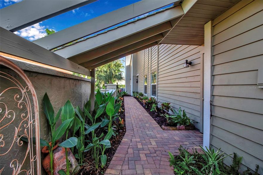 When buyers think about a new home in Florida, they usually have a list of features that are “must haves.” Located in Turnberry Woods, in the heart of El conquistador, near IMG Golf Club, check your list and visit us.
Vaulted ceilings, large rooms and perfectly maintained, you’ll enjoy the beautiful outdoor views throughout. The three bedrooms allows for a large ensuite, guest room, home office and media center.
Condos and villas come in a variety of conditions and layouts. This 3/2 property is impeccably maintained, with a floor plan that offers privacy and options not normally available.
The heart of the entry is the spacious atrium which offers sunlight streaming throughout. The front patio is spacious and has a beautiful garden. The floor plan features a side entry with a beautiful contemporary front door.
Live in the outdoors! The screened in porch is light, airy and adjacent to a large deck, perfect for grilling, entertaining and al fresco dining.
The kitchen features have been updated, granite countertops, stainless steel appliances, a farmhouse sink and a built in wine cooler. The bathrooms feature overheard lighting, large vanities and include walk- in showers with lots of natural light. And that is just a few of the items on an extensive list of upgrades.