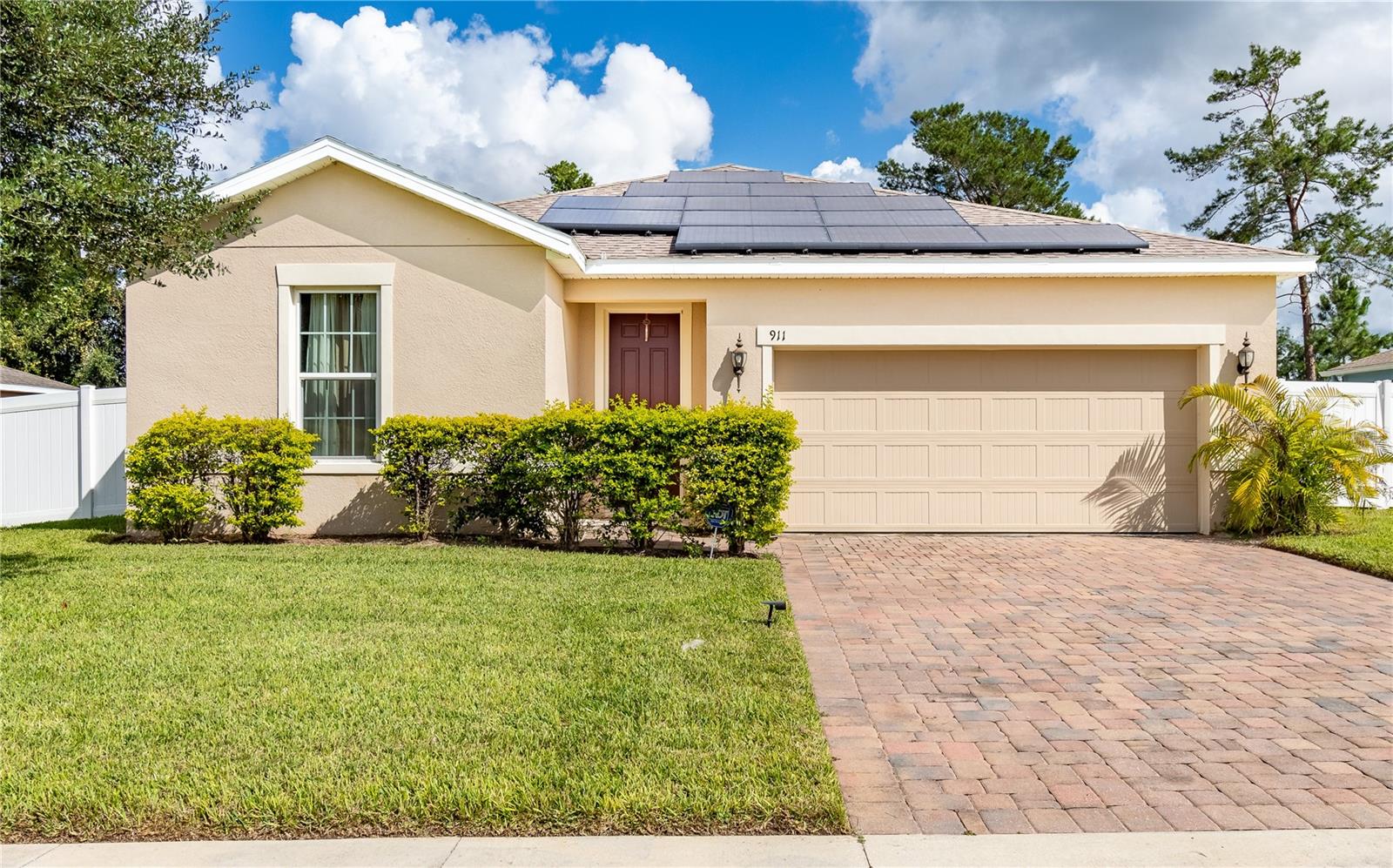 Save big with solar as this energy efficient home offers average electric bills around $40 a month. This well kept 3 bedroom 2 bathroom home in the sought after Shadow Ridge community offers the perfect blend of comfort and convenience. With 1620 square feet of living space and a bright open layout it is ideal for both everyday living and entertaining. The kitchen features a large center island and flows into the spacious living area creating a warm and welcoming space for gathering or relaxing. A split bedroom floor plan provides privacy with the primary suite on one side and two additional bedrooms on the other. Step outside into the fully fenced backyard perfect for pets playtime or enjoying Florida’s sunshine. You will love being just minutes from Target Kohls Starbucks Publix and I4 plus surrounded by nature with parks like Blue Spring State Park Gemini Springs and the Spring to Spring Trail nearby. Zoned for highly rated schools including Manatee Cove Elementary River Springs Middle and University High all within three miles. This home checks all the boxes for easy efficient living. Contact us today to schedule your showing