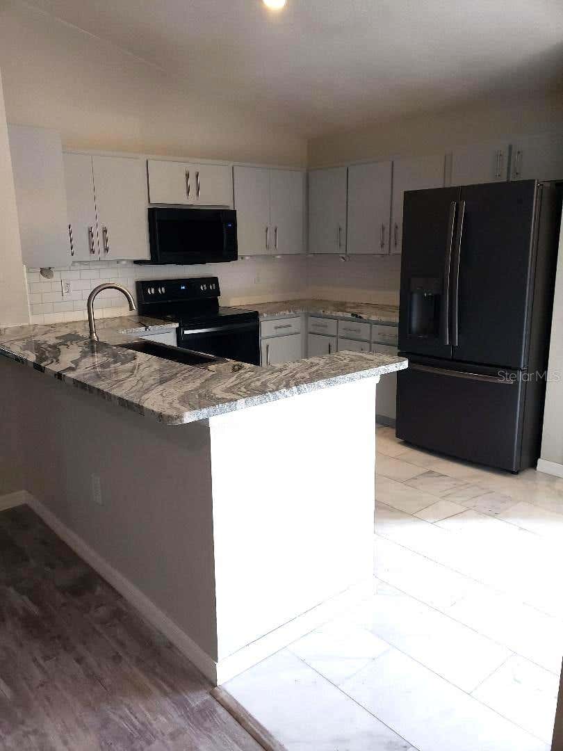 Photo of 4808 Limerick Drive, Tampa, FL 33610 (MLS # TB8535120)
