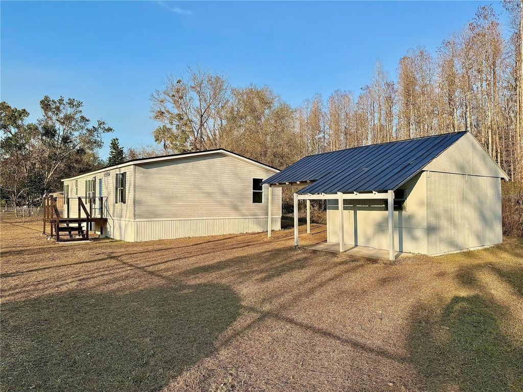 Photo of 7428 Saint Johns Road, Land O Lakes, FL 34638 (MLS # TB8466785)