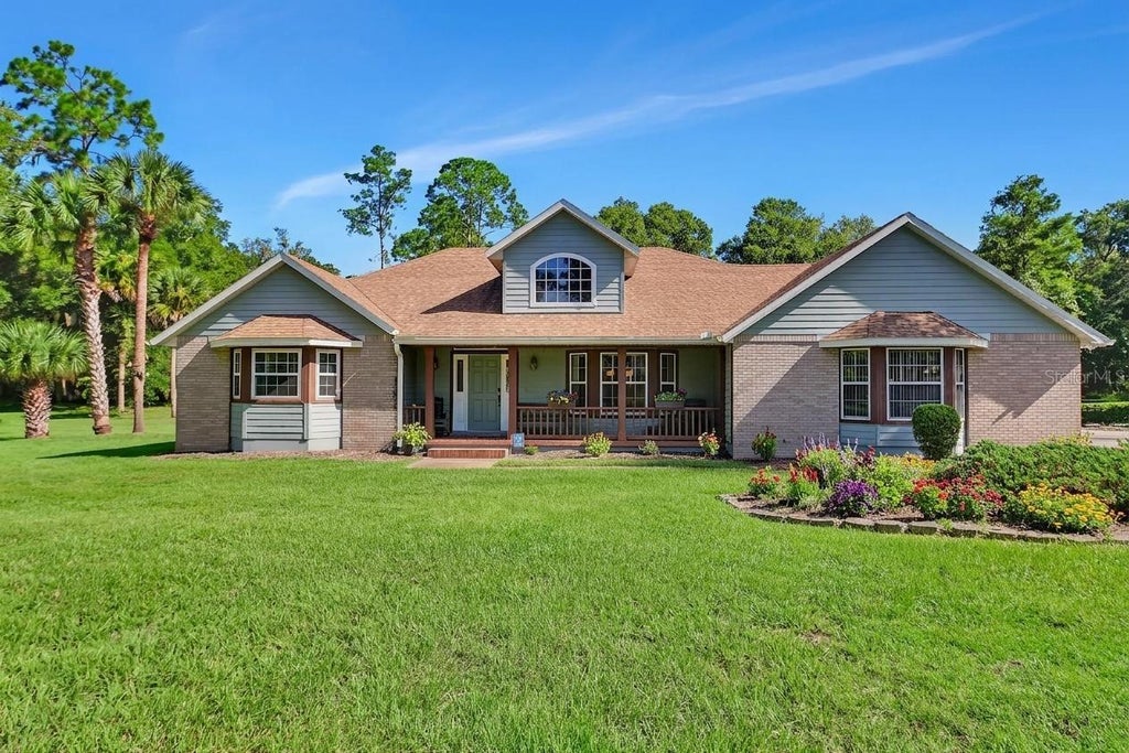 Photo of 1925 Glenwood Oaks Lane, Deland, FL 32720 (MLS # V4950925)