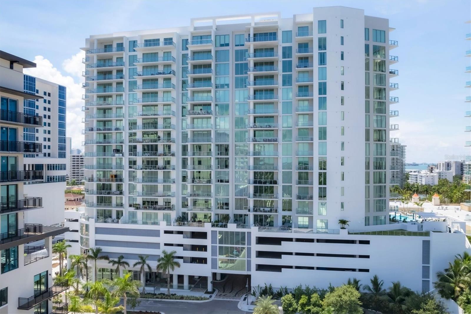 Discover the pinnacle of luxury leasing at BAYSO, Sarasota’s premier waterfront high-rise in the heart of The Quay. This 18-story architectural masterpiece offers a pedestrian-friendly lifestyle amid a dynamic arts and entertainment district, steps from fine dining, luxury shopping and Bay Park Sarasota. Unit 501, a stunning three-bedroom, three-bathroom condominium with den, spans approximately 2,450 square feet, designed for comfort, style and functionality. Soaring 12-foot ceilings and expansive 10-foot sliders and windows flood the open-concept space with natural light, enhancing its modern elegance and showcasing views of Sarasota Bay and the city skyline. Sliding glass doors open to a vast wraparound private terrace from every bedroom and great room, ideal for soaking in breathtaking southern vistas or entertaining guests. The gourmet kitchen exudes design excellence with European-style Italkraft cabinetry, quartz countertops and top-tier JennAir stainless steel appliances, including an induction cooktop, double ovens and a built-in wine cooler. The primary suite is a sanctuary, featuring a spa-like bath with a soaking tub, walk-in shower, GROHE fixtures and amble walk-in closets. BAYSO’s exclusive amenities elevate your lifestyle such as a fifth-floor resort-style pool and spa with bay views, a cutting-edge fitness center, outdoor kitchen, dog park, and a club room with fireplace and catering kitchen. Enjoy convenience with a dedicated property manager, 24-hour concierge and secure entry. Available for lease at $10,000 a month, experience Sarasota’s desirable waterfront address. Schedule your private tour today!