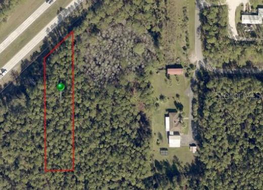 1.49 Acres of vacant land comprised of 2 lots which must be sold together. Lot 1 parcel Id 613001060041 is .93 acres with no observable wetlands and frontage adjacent to highway 92 E International Speedway. The adjacent lot is parcel Id 613001060040 is .56 acres possibly 10-15% wetlands and frontage adjacent to highway 92 E International Speedway. The land has no power, water or septic or sewer. It will require permission to build and create an entry to the roadway. There are 4 lots between the smaller lot and the property located at 2703 Big John Dr.