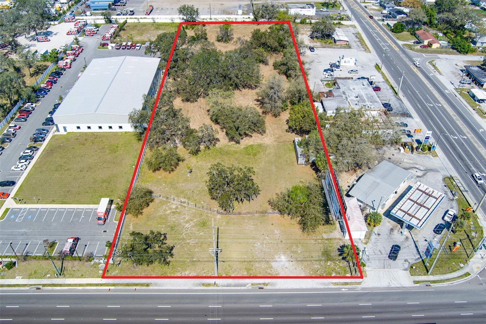 Exceptional 2.82-Acre Commercial Development Opportunity in Tampa. Nestled in the heart of Tampa's dynamic growth corridor, this expansive 2.82-acre property offers an unparalleled opportunity for commercial development. Zoned for Planned Development (PD), the land presents a blank canvas for a visionary project. Current zoning allows for a wide variety of permitted uses that include light industrial, warehousing, research laboratories, offices, hotel, automotive, agricultural and many more uses. The land's flat topography and clear boundaries make it an ideal site for development, significantly reducing construction complexities. Utilities are readily available, with easy connections to essential services such as electricity, water, sewage, and high-speed internet, ensuring that the development process is as smooth as possible. Features 202 feet of frontage on a major thoroughfare FL-579 (E MLK Jr Blvd), complete with two curb cuts and additional deeded easement for access to Orient Rd. Ideally located near I-4, US-301, and I-75, offering excellent connectivity. Property is less than a mile away from Florida State Fair Grounds and the Seminole Hard Rock Casino. Additional income is generated through an existing billboard lease on the property. Tampa's economy is on the rise, and this property is perfectly positioned to capitalize on this growth. The combination of its accessible location, versatile zoning, and development-ready features makes it an ideal investment for forward-thinking developers and businesses. SURVEY, TRANSPORTATION STUDY AND PHASE 1 AVAILABLE FOR REVIEW.