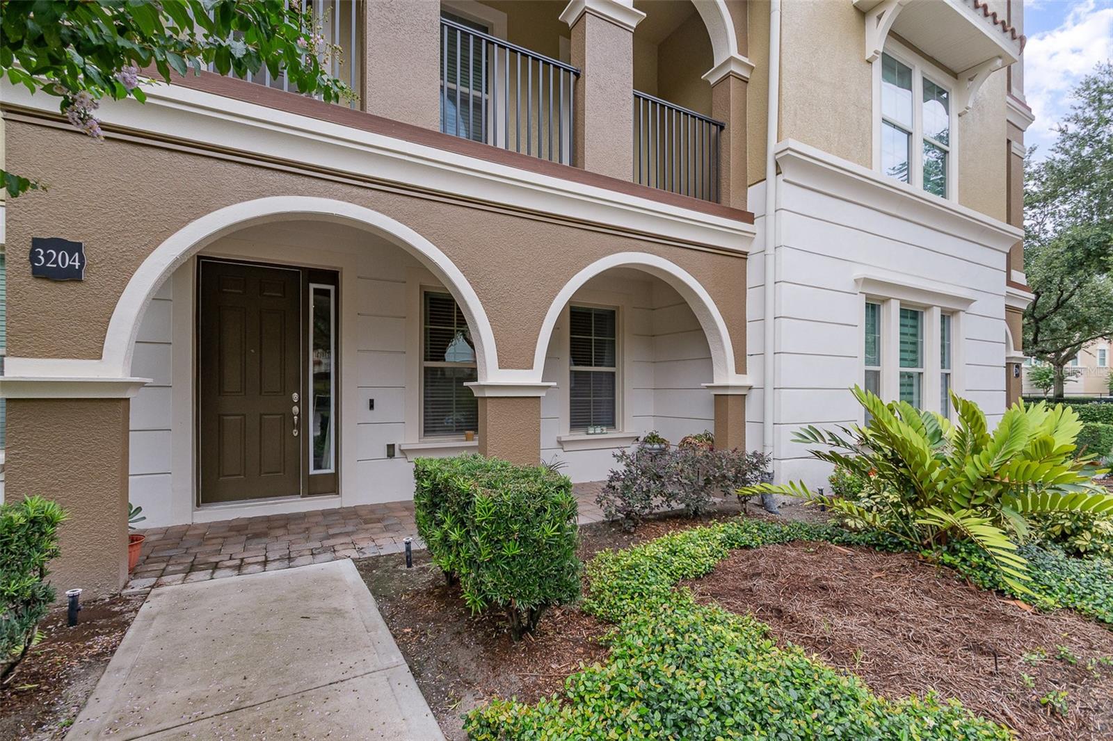 Experience luxury living in this stunning 3-story townhome located in the highly sought-after gated community of Fountain Parke in Lake Mary. Offering 3 spacious bedrooms, 3.5 bathrooms, and over 2,100 square feet of beautifully designed living space, this home seamlessly blends comfort and style. The open-concept main level features a chef-inspired kitchen with granite countertops, a large island, stainless steel appliances, a walk-in pantry, and elegant tile backsplash—perfect for entertaining or everyday living. The ground floor includes a private bedroom with a full bath, ideal for guests or a home office, along with a 2-car garage. Upstairs, the owner’s suite offers a tranquil retreat with an ensuite bath and walk-in closet, while a third bedroom with its own private bath and a full laundry room complete the top level. Residents enjoy resort-style amenities including a sparkling pool and spa, fitness center, tennis and pickleball courts, a dog park, playground, clubhouse, and scenic walking trails. Conveniently located near top-rated Seminole County schools, major highways (I-4 & 417), shopping, dining, and entertainment. This elegant townhome offers the perfect blend of luxury, convenience, and community