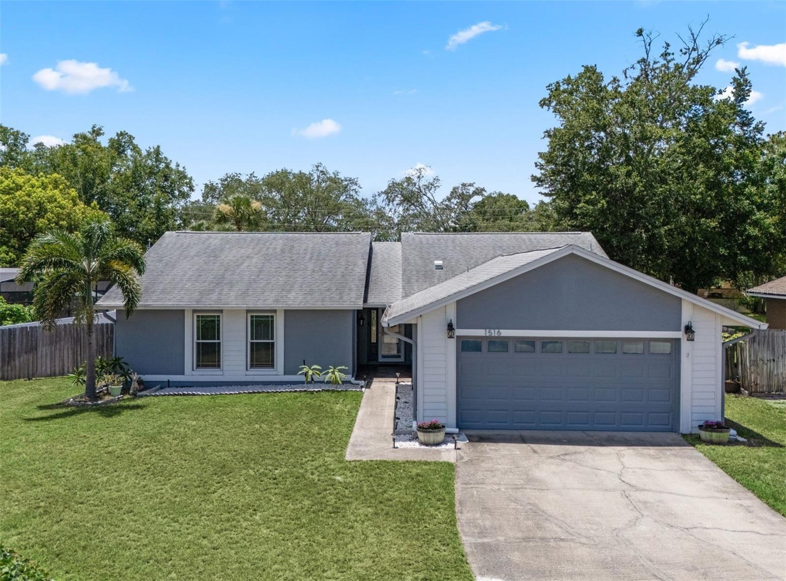 Welcome to this updated 3-bedroom, 2-bath pool home—perfectly located near top-rated schools, parks, and shopping. Inside, luxury vinyl plank floors offer both style and durability. The renovated kitchen shines with granite countertops, soft-close cabinets, pullouts, and a built-in pantry—ideal for cooking and gathering. A cozy living room with a fireplace sets the stage for movie nights, while a versatile bonus room is great for a playroom or home office. Step outside to your screened-in pool deck, spanning the full width of the home—perfect for entertaining or relaxing by the fun, manatee-shaped pool. Childproof fencing and hurricane shutters offer peace of mind. The spacious, fenced backyard gives kiddos and pets room to roam. The primary suite features a large closet, double vanity, and a beautifully tiled shower. The second bath is also updated, and there’s ample storage throughout. Key upgrades include a newer roof (2019), AC (2021), energy-efficient windows, and a wide garage with mounted storage. A large driveway fits up to 10 cars—perfect for guests. If you’re looking for a well-maintained pool home under $500K, this one has it all. Don’t miss your chance—schedule a showing today!