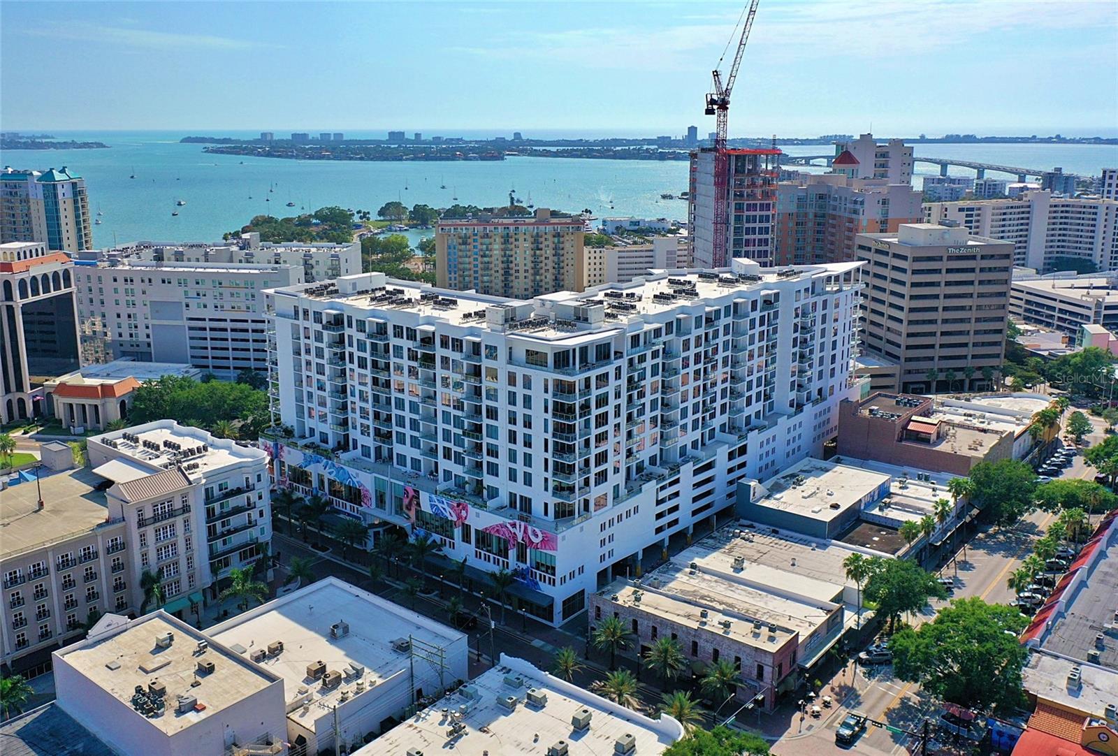 This exquisite penthouse at The Mark condos in the heart of downtown Sarasota offers magnificent views of the city skyline, the Sarasota Bay, and the Gulf of Mexico. There are over $100,000 in upgrades which include custom lighting and automatic window shades. Upon entering the penthouse, you will be immediately struck by its elegance and modernity. The open-concept living area features soaring ceilings, expansive windows, and sleek contemporary finishes. The space is perfect for entertaining with a gourmet kitchen, dining area, and spacious living room that leads to a private terrace with a summer kitchen and gas grill.
The primary bedroom is a true oasis, complete with two spacious walk-in closets and a spa-like bathroom with a deep soaking tub, two separate vanities, glass enclosed water closet and a glass enclosed separate shower. Both the primary and 2nd bedrooms offer views of the Sarasota bay.
This penthouse also includes two reserved parking spaces in the secure garage, and access to The Mark's world-class amenities.
Enjoy a dip in the heated pool, work out in the state-of-the-art fitness center, or entertain guests in the beautifully appointed clubhouse. With its prime location, stunning views, and luxurious amenities, this penthouse at The Mark is the ultimate in Sarasota living. Furniture available for sale and some artwork may be available for sale.