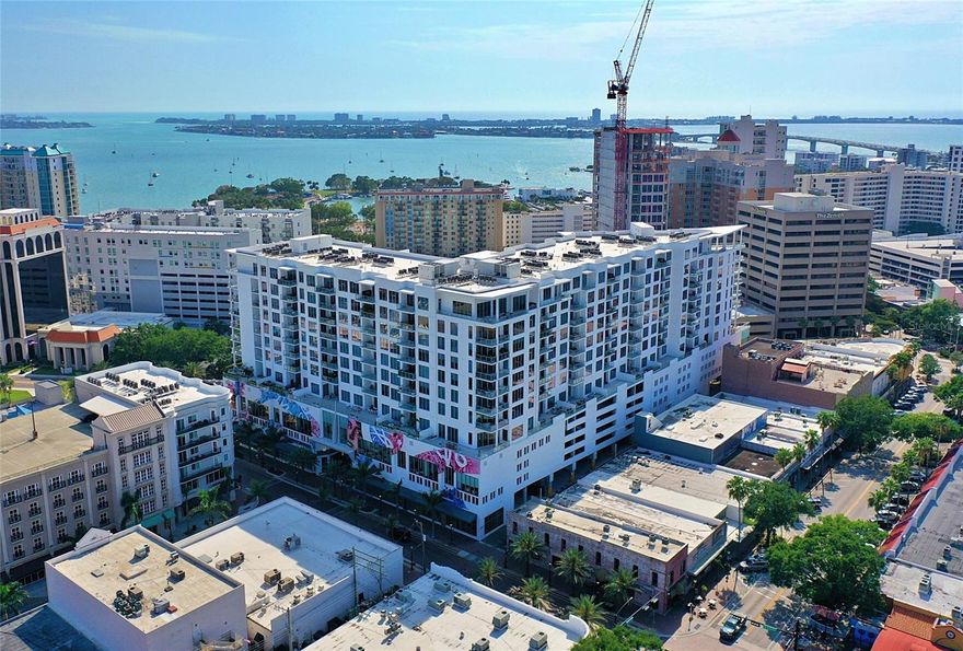 This exquisite penthouse at The Mark condos in the heart of downtown Sarasota offers magnificent views of the city skyline, the Sarasota Bay, and the Gulf of Mexico. There are over $100,000 in upgrades which include custom lighting and automatic window shades. Upon entering the penthouse, you will be immediately struck by its elegance and modernity. The open-concept living area features soaring ceilings, expansive windows, and sleek contemporary finishes. The space is perfect for entertaining with a gourmet kitchen, dining area, and spacious living room that leads to a private terrace with a summer kitchen and gas grill. 

The primary bedroom is a true oasis, complete with two spacious walk-in closets and a spa-like bathroom with a deep soaking tub, two separate vanities, glass enclosed water closet and a glass enclosed separate shower. Both the primary and 2nd bedrooms offer views of the Sarasota bay. 

This penthouse also includes two reserved parking spaces in the secure garage, and access to The Mark's world-class amenities. 
Enjoy a dip in the heated pool, work out in the state-of-the-art fitness center, or entertain guests in the beautifully appointed clubhouse. With its prime location, stunning views, and luxurious amenities, this penthouse at The Mark is the ultimate in Sarasota living. Furniture available for sale and some artwork may be available for sale.