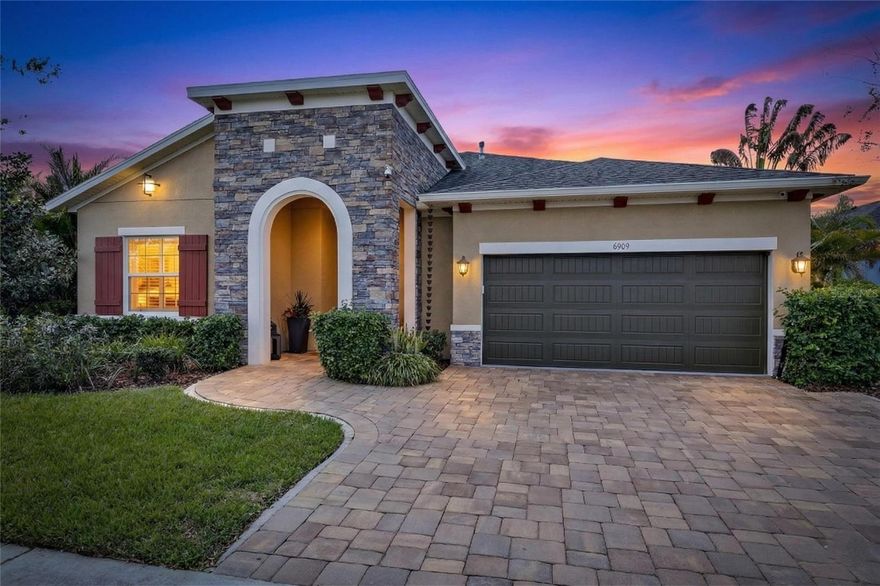 6909 Crestpoint Drive, Apollo Beach, FL 33572 | 3 Bed | 3 Bath | 2,554 Sq Ft | Pool Home on Conservation Lot | David Weekley | Waterset

Some homes check boxes. This one captures a lifestyle. Tucked behind a private conservation lot in one of Apollo Beach's most sought-after communities, 6909 Crestpoint Drive is the rare Waterset home that delivers high-end design, meaningful upgrades, and a backyard that will stop you mid-sentence the moment you see it.
This David Weekly home is major quality. The stacked stone elevation, brick paver driveway and entrance, and covered front porch set the tone before you ever step inside. Inside, you'll notice the difference — this floor plan is larger than most in the community, with an open-concept living area that gives the space a natural, unhurried flow. High grade Pergo waterproof laminate wood flooring runs throughout the main living areas, and large sliding glass doors frame the conservation views like living artwork from the moment you walk in.
The kitchen is the heart of this home. An oversized island with counter seating anchors the space, surrounded by wood cabinetry, granite countertops, and stainless steel appliances including a brand-new LG refrigerator and dishwasher installed in 2025. A dedicated flex space just off the kitchen functions beautifully as a formal dining room or reading nook. A second flex space toward the front is currently used as a private home office and works equally well as a guest room or creative studio. The owner's suite is a true retreat — dual-sink vanity, soaking tub, walk-in shower, and a spacious walk-in closet. Two additional bedrooms and a well-appointed second bath round out the interior.
Don't let the garage door fool you. What appears to be a standard two-car garage is actually a full three-car climate-controlled, fully insulated space — ceiling, walls, and door — wide and deep enough for two vehicles, a golf cart, motorcycles, or a serious workshop setup. And for the four-legged members of the family, a rare side yard gives your pets their own dedicated outdoor space, a genuine find in this community.
Then there's the backyard — and this is where 6909 Crestpoint becomes something truly special. The 3 year old custom pool is built around fully automated, app-controlled Pentair equipment with a salt system, 4 color changing lights, a DE filter for the clearest water quality and a 4-foot wide sheer descent waterfall, and an oversized 9x6 spa with 21 jets and a blower. The Pool interior finish is WetEdge Technology - a 25 year glass pebble interior finish in the pool. The entire pool is heated. The travertine deck surrounds it all, and a fully equipped outdoor kitchen completes the picture overlooking a permanent conservation area that cannot be built on. 
The house has a “tubes in the walls” pest control system, with a single pest control port accessed from the outside. New HVAC installed in 2025. Fresh interior and exterior paint throughout. Living in Waterset means access to two fitness centers, multiple resort-style pools, splash pads, dog parks, and 12 miles of trails. Apollo Beach puts you 25 minutes from downtown Tampa, MacDill AFB, and the Selmon Expressway. This home is professionally decorated, mechanically updated, and sitting on a conservation lot with a top-of-the-line custom pool, a climate-controlled three-car garage, a rare side yard, and a permanent nature view most buyers spend years trying to find. It is ready for you now.