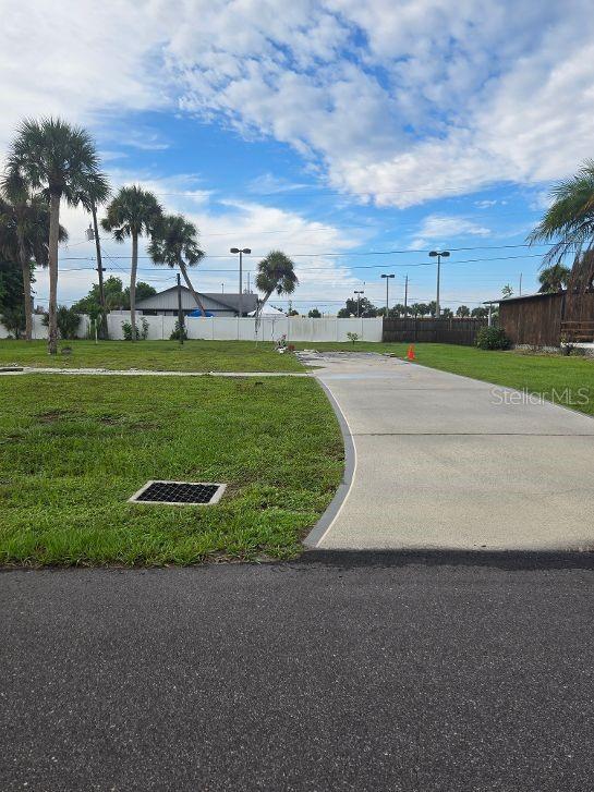 Jhis mobile home lot has approximately $24,000. in building and water and sewer impact fees paid and now ready for you new home. Manatee Cove (Holiday Mobile Estates) is a 55 and older community that has much to do with low association dues for the club house that has many activities thru out the year. There is a boat launch (for a small key fee) that connects to Lemon Bay and Gulf of America. It is only two miles to the beautiful beaches on the gulf. Close at hand are stores, restaurants, golf courses, boat launches and much, much more. See you soon.