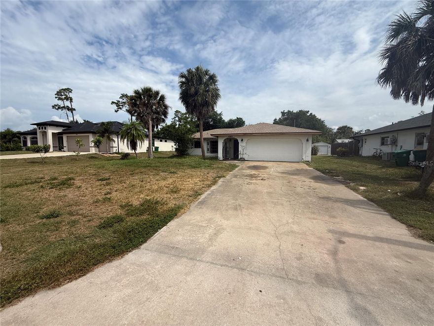 2-bedroom, 2-bath pool home with a 2-car garage, centrally located in Port Charlotte and full of potential! This property needs some TLC and is perfect for an investor, handyman, or buyer ready to bring their imagination and transform it into a primary residence, seasonal getaway, or rental property — with no rental restrictions.

Featuring over 1,500 square feet of living space with tile floors throughout, this home offers a split-bedroom floor plan, large living area, public water, newer roof (2025), and newer hot water heater ( 2023) . Air conditioner and garage door were replaced in 2005 . Step outside to enjoy the screened-in lanai, private pool, and spacious backyard with plenty of room to create your own outdoor oasis.

Opportunity awaits — come see the possibilities this home has to offer!