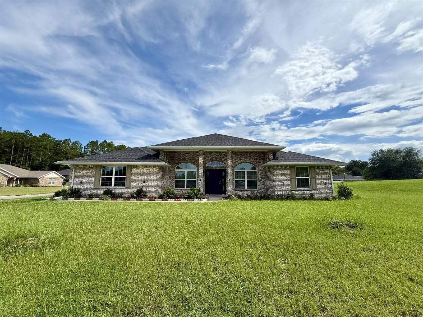 Embrace comfort and elegance in this beautiful 4-bedroom, 2-bath single-story home. The exterior boasts a timeless full brick façade accented with a rare fan-shaped glass detail at the front, adding a unique architectural charm. The front yard has been lovingly transformed by the owner into a picturesque garden, creating a warm and inviting welcome every time you come home.
Inside, a dedicated office space sits just to the right of the entryway?perfect for working or studying from home. The open-concept design seamlessly connects the kitchen and family room, filling the interior with natural light and an airy atmosphere. The primary suite features an impressive vaulted ceiling, walk-in closet, and a luxurious bath, offering both comfort and privacy.
Step outside to the covered patio, an ideal space for relaxing or entertaining with family and friends. A home that combines curb appeal with exceptional living comfort?ready for you to discover!