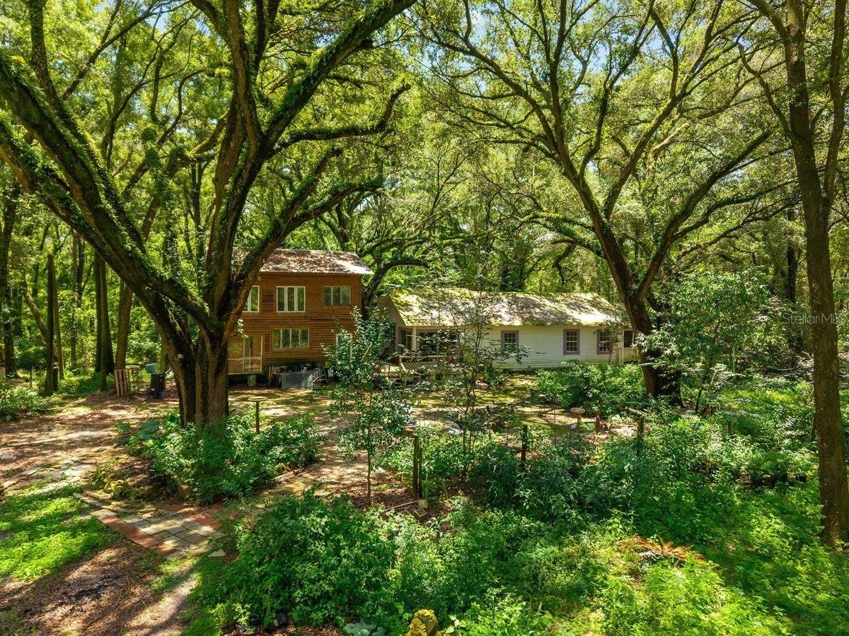 Bring Your Vision – 13.33 Acres of Great Opportunity in Archer, FL! Welcome to a Stunning Agriculturally Zoned Property where natural beauty and endless possibilities meet. This Unique Parcel features approximately 6 Acres of Open Fields and 7.33 Acres of Majestic, Mature Trees—perfect for your Dream Homestead, Farm Animals, or Rural Retreat.
The land is teeming with Abundant Wildlife, including deer, birds, and graceful sandhill cranes. Towering, centuries-old live oaks and a variety of flowering shrubs and trees add to the charm and character of the landscape, creating a peaceful, park-like setting.
An Older 3-Bedroom, 1-Bath Home is ready for renovation and rests on a solid foundation—ideal for rebuilding or restoring. A 576 sq ft Unfinished Pole Barn Building offers potential additional space for a Guest House, Storage, or Workshop needs.
Enjoy the tranquility of country living with the convenience of town just minutes away—10 minutes to Newberry and 15 minutes to Gainesville. Bring your imagination and make this special piece of land your own. Motivated Seller – Don’t Miss This Incredible Opportunity!