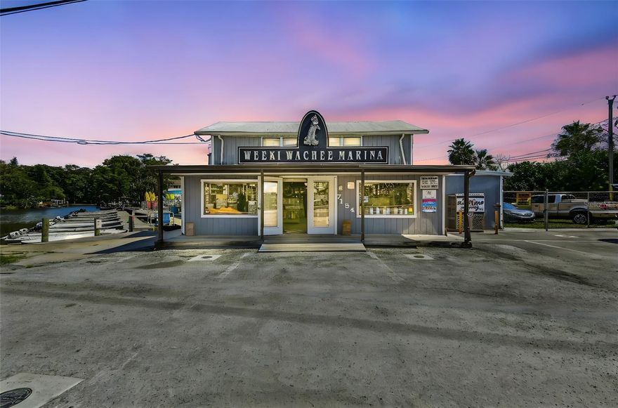 A once-in-a-lifetime chance to own a thriving waterfront business and property in the heart of Weeki Wachee Gardens, one of Florida’s most iconic natural spring destinations. Perfectly positioned on Shoal Line Road with direct access to the Weeki Wachee River, this multi-use property spans three waterfront parcels and has been family-owned for decades. Now available for the first time in generations, it presents a true turn-key business with multiple income streams and long-term value.
Direct access to the internationally known Weeki Wachee River, famous for its crystal-clear waters, manatees, dolphins, kayaking, boating, and eco-tourism. Very limited commercial availability makes this a rare find.

 Spacious retail building offering fishing and boating supplies, plus an on-site ice machine generating income.

Marine Services – Authorized Suzuki Service provider with established motor repair business. Includes a large enclosed service area with bay door and private office space.

Fuel Sales – Exclusive on-river fueling station.

Rental Operations – Income from jon boat rentals, kayak and paddleboard rentals, dock space for commercial vessels, and private vessel storage.

Residential Quarters – Upstairs living space above the retail store, perfect for a live-in manager or potential Airbnb rental.

Experienced Staff – Long-standing team in place for service and repair operations, ensuring a seamless transition.

Expansion Potential – Multi-use flexibility provides opportunities for additional income or new ventures.


Three waterfront lots, including a large building with residential space above.

Diverse income sources: retail, fuel, service, rentals, and storage.

Surrounded by Airbnb rentals, Weeki Wachee Preserve, Rogers Park, and just minutes to Hernando Beach and the Gulf.

Prime visibility and exposure with only one road in and out.

This is a unique chance to acquire a well-established waterfront business with irreplaceable real estate on the Weeki Wachee River. Whether you continue the proven operations or reimagine the space, the potential here is unmatched.