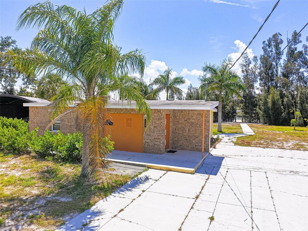Photo of 891 Palmetto Drive NE, Port Charlotte, FL 33952 (MLS # C7525536)