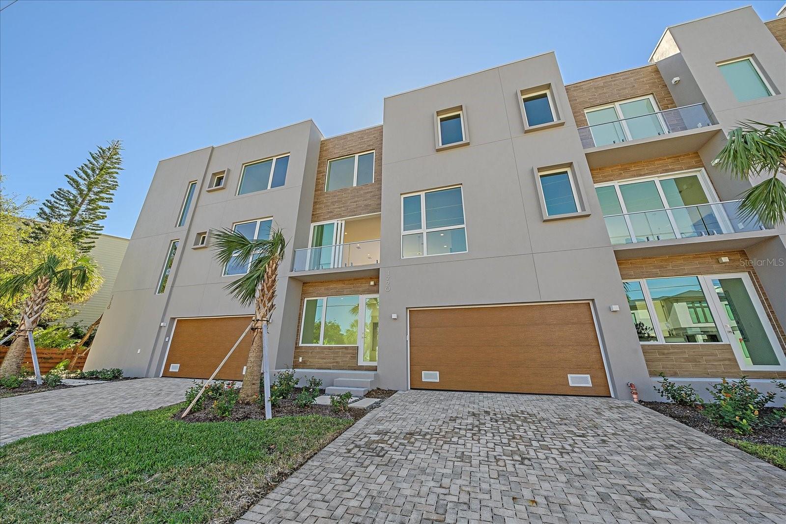 Discover Luxury Living at Laurel on the Water! Nestled within an exclusive enclave of seven canal-front townhomes, 1720 Alderman St embodies contemporary elegance and coastal refinement in the heart of Sarasota, Florida. Priced at $1,860,000, this newly constructed, three-story townhouse (with elevator) offers a blend of modern design and vibrant lifestyle, just blocks from the bustling downtown area.
The unique modern architecture seamlessly connects with the serene waterfront, providing an ideal setting for enjoying the best of Florida living. The home features a versatile great room on the first floor, which can serve as an office, third bedroom, or entertainment area, complete with separate entrances for added convenience.
Step inside and be captivated by sleek, modern design elements, including waterfall kitchen island, expansive impact glass windows that invite natural light and breathtaking water views. Balconies on multiple levels allow you to bask in the beauty of the surroundings while enjoying the coastal breeze.
For boating enthusiasts, the option to acquire a private boat slip for an additional cost of $50,000 provides easy access to jet skiing, paddle boarding, kayaking, and the charming waterways of Sarasota. This maintenance-free neighborhood brings the luxury of care-free living while keeping you close to the waterfront, marina, downtown, and world-renowned beaches.
As part of the Laurel on the Water community, residents can enjoy access to a refreshing pool, enhancing the resort-like atmosphere of this remarkable enclave.
The lifestyle you’ll embrace here is unmatched – immerse yourself in Sarasota’s rich cultural scene, with attractions like the renowned Ringling Museum, vibrant theaters, and an impressive selection of Zagat-rated restaurants. Siesta Key Beach, celebrated nationally for its pristine sands, is nearby, ensuring sun-drenched days and serene enjoyment under sunset skies.
With a spacious two-car garage, this luxurious townhouse is not just a place to live but a gateway to a vibrant community filled with exquisite dining, boutique shopping, farmer’s markets, and an array of outdoor adventures, including access to over 76 golf courses within a 15-mile radius.
1720 Alderman St represents more than just a property; it’s an invitation to experience an unparalleled lifestyle of luxury, culture, and outdoor recreation. Don’t miss this exceptional opportunity to own a piece of Sarasota paradise—schedule your private tour today!