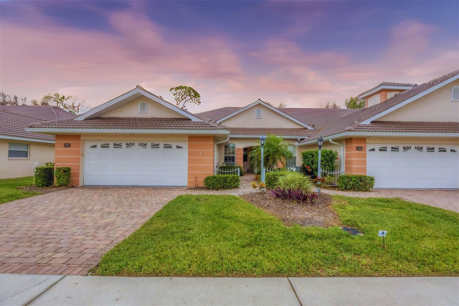 Welcome to this beautifully updated END-UNIT villa located in the gated community of Bobcat Trail, where tranquil surroundings and native Florida wildlife create a peaceful setting. From the private, screened lanai, you can enjoy serene mornings and quiet afternoons in comfort. Inside, the open layout features 3 bedrooms, 2 full bathrooms, and an oversized 2 car garage. Recent renovations include luxury vinyl plank flooring throughout, fresh interior paint, plantation shutters, updated lighting and ceiling fans, new interior door hardware, and a new washer and dryer. The spacious kitchen is designed with granite countertops, a stylish tile backsplash, modern appliances, a large center island, abundant cabinetry, and a pantry for extra storage. The primary suite includes a generous walk-in closet and a well-appointed bathroom with dual sinks, granite counters, and a walk-in shower. A new roof was installed in 2024, offering added peace of mind. Bobcat Trail is known for its welcoming atmosphere and offers residents access to a community pool as well as a separate private pool reserved exclusively for villa owners, along with tennis and pickleball courts, a fitness center, a small library, and a clubhouse with regularly scheduled social events. Conveniently located just 30 minutes from Gulf Coast beaches and close to shopping, dining, and the Atlanta Braves Spring Training stadium, this home also benefits from being outside the flood zone. The CDD fee is included in the property taxes, and the HOA dues cover exterior maintenance, including the roof. This move-in-ready villa is a fantastic opportunity for comfortable, low-maintenance living in a secure and active community—schedule your private showing today. THE SELLER IS WILLING TO CONTRIBUTE TOWARDS BUYER'S CLOSING COSTS OR RATE BUY-DOWN