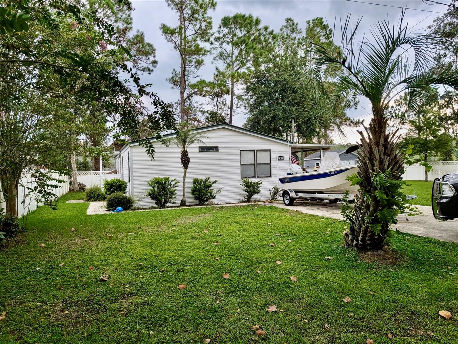 Very well kept home on a corner lot with a nice front porch, large side yard, and a storage shed for all your tools. This home offers 3 bedrooms, 2 full bathrooms in a unique and inviting layout. This is a lovely home right next to the Lake County Library and park. The park offers baseball, basketball, pickleball, and a dog park. The library has lots of events every week including exercise and painting classes. This home is less than 2 miles from the public boat ramp to the St. John's River.