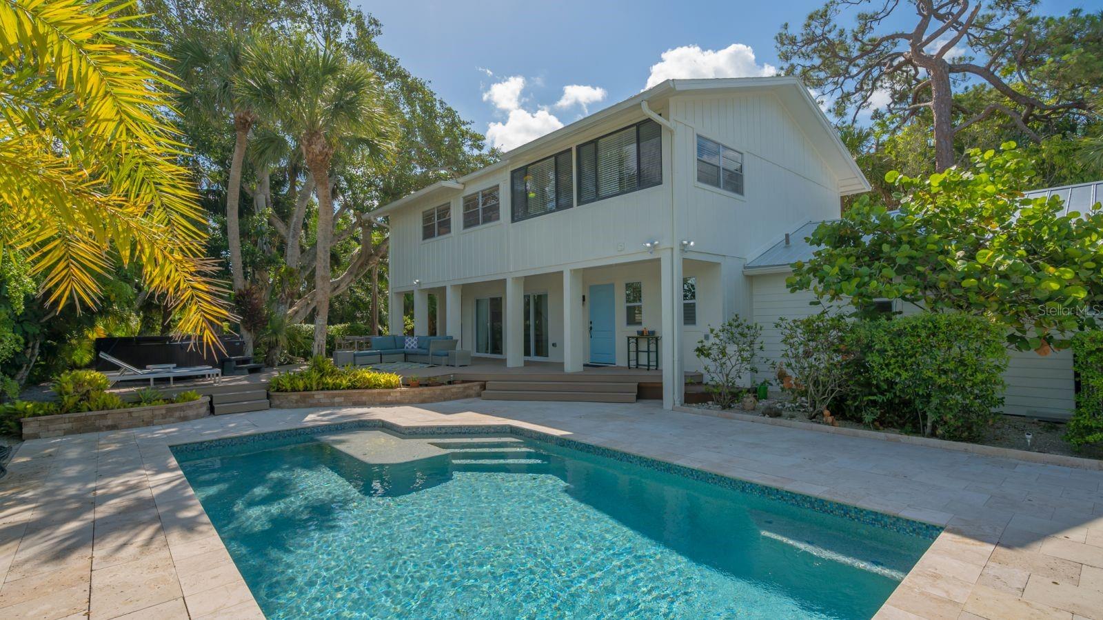 CASEY KEY HOME... This home has room for everyone with five bedrooms and two full bathrooms and two half bathrooms. This is an interior lot with the utmost in privacy with a heated pool and hot tub. Only a few steps from a private access to the Casey Key Beach. The house also has access to a day dock on the intracoastal. This home offers two separate kitchen areas and living rooms. The first floor has two bedrooms and one and half bathrooms. On the second floor there are three bedrooms one and half bathrooms. There is also a bonus room on the second floor that could be a playroom or den. It is a short drive to the North Bridge on Blackburn Point Road, near restaurants and shopping. Come and discover a Florida paradise!!!