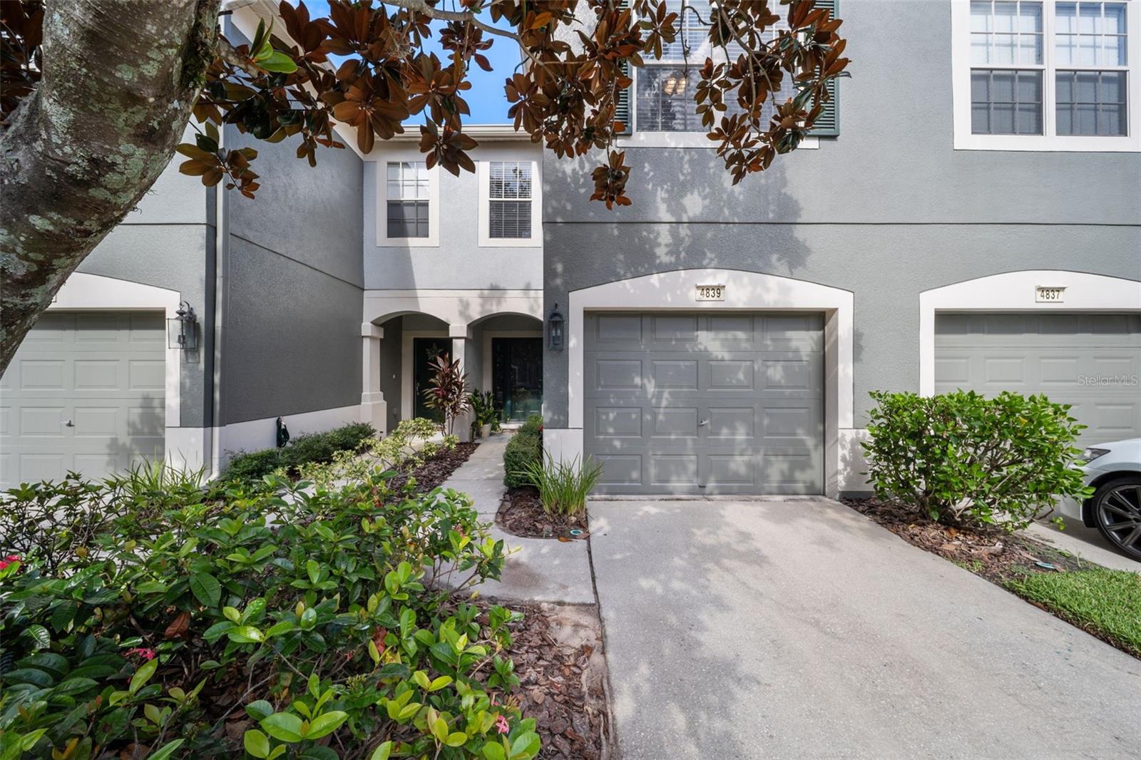 Welcome to a refreshed and move-in ready gem nestled in the highly desirable Valhalla gated community of Riverview. This light-filled three-bedroom, two-and-a-half-bath townhome offers 1,644 square feet of comfortable Florida living with stylish upgrades and maintenance-free ease. Sleek plank flooring flow seamlessly throughout the main living areas and tile in bathrooms and laundry, complemented by fresh, neutral paint that enhances the bright, open floorplan. The updated kitchen features beautiful granite countertops, stainless steel appliances, and a layout that opens to the living and dining areas—ideal for casual gatherings. Just beyond, a tall sliding glass door leads out to the private covered and screened lanai, offering serene, treed views and a peaceful spot for morning coffee or evening wind-down.
Upstairs, the generous primary suite includes dual vanities, an enclosed water closet, and plenty of closet space. Two additional bedrooms share a refreshed hallway bath, while the convenient upstairs laundry makes everyday living simple. The home also boasts a one-car garage with a newly epoxy-coated floor, providing both durability and a polished finish.
Valhalla is a gated, pet-friendly community designed for maintenance-free living, with exterior upkeep, water, trash, basic cable/internet, and lawn care all included. Residents enjoy access to two resort-style pools, plenty of guest parking, and beautifully maintained common areas. Conveniently located near I-75, the Crosstown Expressway, and U.S. 301, the home provides quick access to downtown Tampa, MacDill AFB, Ybor, shopping, dining, and entertainment.
Built in 2005, this townhome combines practical updates with an ideal location. Whether you’re a first-time buyer, relocating, or seeking a low-maintenance lifestyle, this Valhalla beauty is ready to welcome you home.