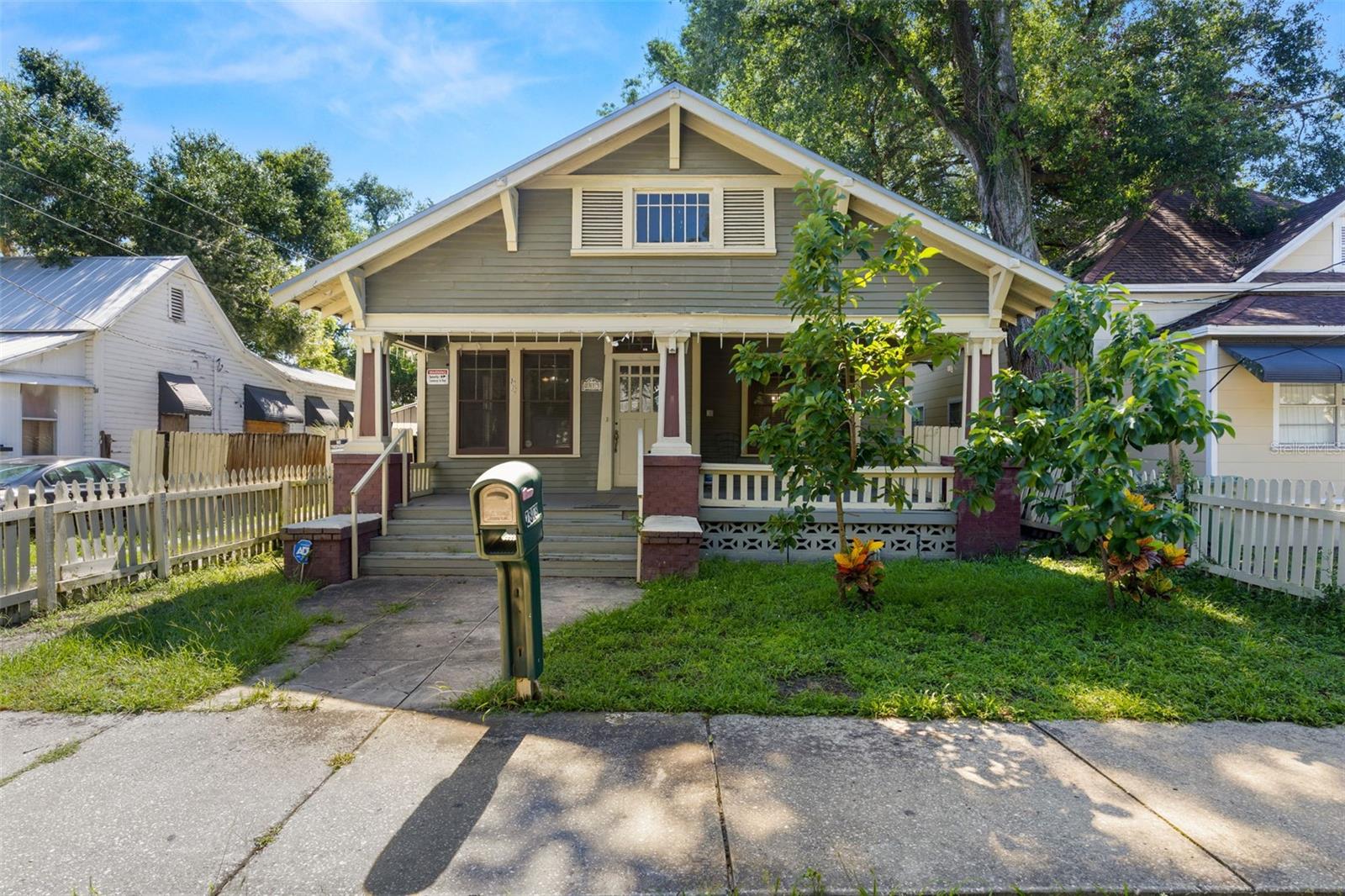 INVESTORS! Opportunity awaits with this spacious fixer-upper located in the heart of Tampa Heights, just minutes from downtown Tampa, Armature Works, and the highly anticipated new YMCA project. Bursting with charm and flexibility, this unique property offers a rare combination of space, location, and income potential. The main home features 5 bedrooms and 4 full bathrooms, with two bedrooms offering en-suite baths — perfect for multi-generational living. The second level of the home provides additional square footage not currently reflected in public records, offering even more value for those ready to bring their vision to life. In addition to the main residence, the property includes a fully equipped 1-bedroom apartment in the detached ADU, ideal for rental income. Below the ADU, a finished downstairs space with a full bathroom provides further flexible use and can be easily converted back into a garage for off-street parking via alleyway access. Whether you're an investor or homeowner looking to renovate and capitalize on one of Tampa’s fastest-growing neighborhoods, this is an incredible opportunity to own a property with versatility, character, and upside potential in a prime location. Don't miss your chance to transform this diamond in the rough into your next success story.