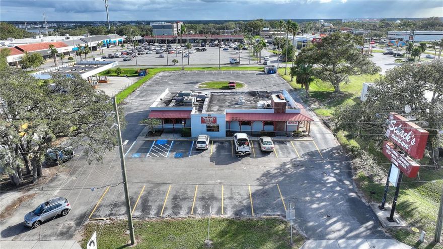We are offering this rare opportunity to acquire a prime commercial property located between Tampa and Orlando and within the Cypress Gardens neighborhood of Winter Haven! This local well known Bar-B-Que restaurant space features an expansive masonry structure of nearly 4,700 square feet on a generous 1.03 acre of land including 150’ of road frontage. The building offers a large walk-in cooler, a sizable wood fire pit, grease trap, a range hood system, multiple exhaust systems, (2) Restrooms, Large Lobby with a waiting area near the main entryway.  The property benefits from easy access, ample parking and a loading delivery area in the rear of the building. Visibility is paramount, enhanced by a large monument sign at the entrance. It is positioned just off the signalized intersection of Cypress Gardens Blvd (AADT 41,500) and Cypress Gardens Road (AADT 13,300). Adjacency to Cypress Garden Blvd adds a layer of convenience and exposure, solidifying its position as a prime business location.  It is in super close proximity to prominent neighborhoods, Courtyard Marriott, the new AdventHealth Hospital and Legoland Amusement Park.