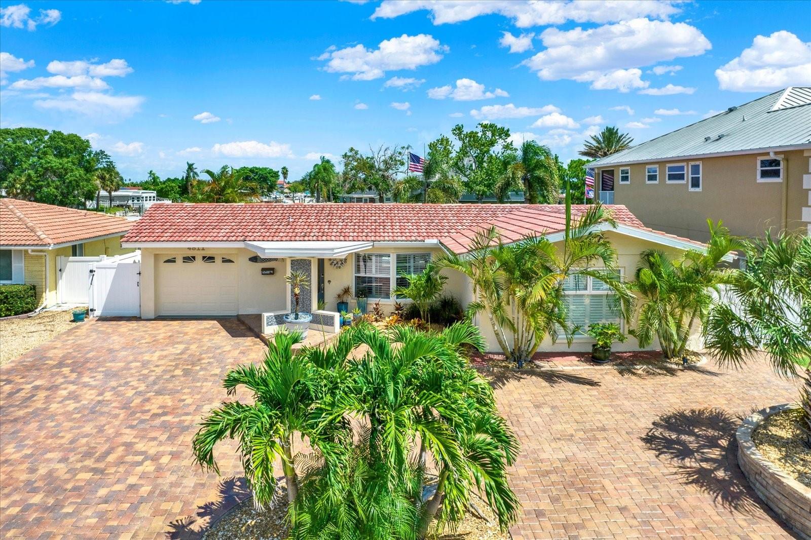 Waterfront Luxury is calling you! Lets Gulf! Live the lifestyle you have been dreaming of. This one checks all the boxes—and more. Quietly tucked away on a cul-de-sac / dead end with minimal traffic & peaceful living! Paradise is calling in this 3-bedroom 2.5 bath salt water POOL home positioned directly on the deep, wide south channel of Gulf Harbors! (New Pool 2023 & it's gorgeous)
Interior is impressive with an extra-large primary walk-in closet, brass finishes in the kitchen, granite, new cabinets, top-of-the-line disposal, & updated decor, new flooring, ceiling fans, spa bathrooms, plantation shutters, updated windows & sliders, brand new kitchen with stainless steel GE appliance package! (all of the fine furnishings convey, including washer & dryer) HVAC 2019, Water heater 2025, Pool = 2023, years remaining on the clay tile roof. Flat roof replaced in 2020.
Home had flood damage from the 2024 Hurricane Helene & has been completely remediated & remodeled to comply with county code & all work is fully permitted and closed!
Nothing to do except move in. Every detail of the property has been impeccably updated! Fine finishes and upscale furnishings (included in the sale) have been hand-picked to create a “high-end coastal vibe” that matches the impeccable outdoor entertaining/living space where your family and friends will bask & enjoy a truly remarkable tropical paradise. Minimal yard care with this professionally paved front yard, adding to the Mediterranean ambiance/curb appeal & clay tile roof! Boasting ample parking space for guests!
Outdoor living space includes: Covered tik for cooking on the BULL gas grill + table/chairs for gathering,+ new outdoor fridge. The evening lighting is spot on! - Stationary Dock, Floating Dock + Boat lift provide the space needed for all of your watercraft! Dock & deck made from top-of-the-line composite construction that lasts forever! (low maintenance) Situated on the south channel of Gulf Harbors, where the water is deep and the channel is wide to accommodate large vessels, including sailboats! Extra-large covered dock storage boxes included + extra space for kayaks and paddleboards! Electric + water at the dock! Cranes Roost seating to watch the sunsets from a raised level = amazing feature! Adirondack chairs (hand-made) are included!
* furnished with Tommy Bahama + Arnold Palmer + high end wall decor. It's all included !
Firepit + coastal seating for entertaining. Salt water Pool with lounging pad. This home boasts a 5-star outdoor living space that will deliver resort/paradise experiences for you and your guests, coupled with sunsets that humble the soul! This one is worth your time to tour! You will not be disappointed touring this beauty on Shell Stream! The VIAGGIO boat is for sale! This home delivers on quality of work + waterfront location, + exceptional outdoor living space!
Community offers 2 boat ramps + a private beach (optional to join) and a local YACHT club (optional to join)