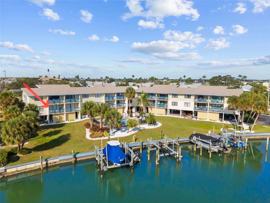 Welcome to 11650 Capri Cir S #108! Enjoy the best of coastal living at Tides of Capri West! This community consists of just 16 units, offering residents a rare combination of tranquility, waterfront access, and close proximity to Treasure Island’s beautiful beaches - just a 5-min walk! Enjoy sweeping water views from the moment you enter this bright and spacious HIGH & DRY 2-bedroom, 2-bath CORNER-UNIT home! The generously sized primary bedroom features water views, a large walk-in closet, recently renovated ensuite bathroom, and access to your private waterfront balcony. The second bedroom provides added privacy with its own ensuite bathroom, complete with a tub and ample closet space. The kitchen combines functionality and style with stainless steel appliances, ample cabinetry, solid-surface counters, and a stylish coastal backsplash. The living room features a stunning custom wood ceiling with built-in sound-dampening design. Step out onto your private balcony and take in views of the Waterway and the inviting community pool. Inside, you’ll find hurricane-impact windows throughout, providing not only enhanced safety and energy efficiency but also a quiet, serene interior. Elegant plantation shutters add a touch of coastal charm and timeless sophistication to every room. In-Unit Full Size Washer and Dryer. Your assigned, covered carport is just beneath the unit and features a water hookup and direct access to a private, oversized storage closet with electrical connection! Spend your days lounging by the waterfront community pool, where gentle breezes and peaceful water views create the perfect coastal retreat. BOAT SLIPS available for rent from the association! Roselli Park sits just across the street, offering a variety of amenities including baseball fields, tennis and pickleball courts, basketball, shuffleboard, and a newly renovated playground and dog park. This unit is on the 2nd floor and did not sustain any damage during either most recent hurricanes. Experience the ultimate blend of comfort, convenience, and coastal beauty—this is Treasure Island living at its finest!