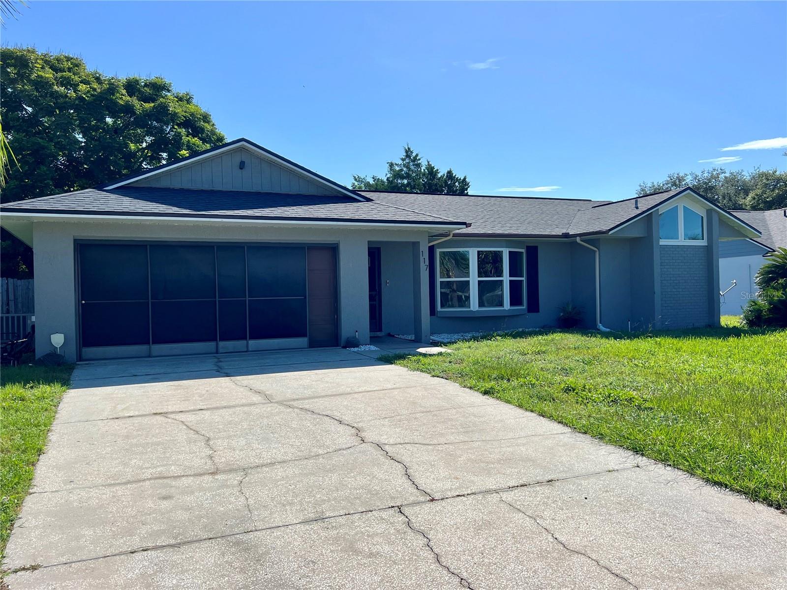 Nicely updated 3 bedroom, 2 bathroom pool home in the Ridgeview Community. The split floor plan offers a spacious gathering area along with a kitchen that is centrally located. Laminate wood flooring throughout most of the home ceramic tile in kitchen and dining areas. Primary suite offers a spacious bathroom, his & hers closets, large shower and access to the patio and pool. Out back you'll find a screened in porch and pool, great for gatherings, grilling, playing, or jut to relax. Washer & dryer included in the garage. Make your appointment to see it!