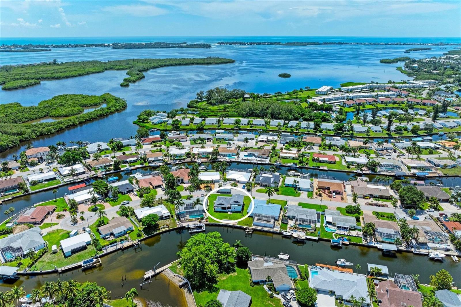 WATERFRONT, PRIVATE BOAT DOCK with quick access to the Gulf of America! This is a home could be your DREAM COME TRUE! LOCATION, LOCATION!! Minutes to ANNA MARIA ISLAND & all the conveniences sought after from shopping, restaurants, schools, hospitals, airports and entertainment. Enjoy this Spacious home on a SALTWATER CANAL that will lead you directly out to the Sarasota Bay to AMI and Longboat Key and enjoy the turquoise blue waters on the Gulf of America. The #1 location to watch the beautiful sunsets and playing dolphins. If you are a beach-goer, fisherman, boater, or just like to have a GREAT WATER VIEW, you are sure to delight in this home in Coral Shores with plenty of room with a 4 car garage and driveway. No High Hoa Fees here! and No Deed Restrictions. Rare opportunity to enjoy worry-free living without flooding. Many waterfront Restaurants. Dock your boat right in your backyard. This elevated two-story gem, featuring a bedroom on the main level and built in 1983, is filled with value and potential. It boasts a NEW ROOF, brand NEW SEAWALL, two NEW AC units, and a NEW water heater, and has been previously tented. Reimagine and renovate to suit your needs. Virtual staging has been added to help spark your imagination.
The home features an open kitchen with a breakfast bar, a formal dining room or sitting area, and a casual living room with tranquil water views. An enclosed screened-in porch is perfect for enjoying the breezes. Additional spaces include a formal dining room or office and a large formal living room, providing plenty of room to enjoy life. Entertaining is effortless with ample guest parking and a welcoming front entrance. A conveniently located main-level bedroom and full bath, along with laundry facilities on the main floor, add comfort.
The oversized primary suite serves as a private retreat with beautiful views, a built-in wet bar, and two spacious walk-in closets. A second large bedroom with a walk-in closet can accommodate up to eight. Bring the families—it's vacation time. Customize this fixer-upper according to your taste.
The FOUR CAR GARAGE, constructed with STEEL BEAMS and featuring oversized high ceilings, has been converted to include a storage room but can easily be reverted. It includes a utility sink and a workbench area. The converted room can serve as extra storage.
The expansive backyard presents a blank canvas for your imagination—envision your dream pool, outdoor kitchen, tiki bar, or large play area. With well water irrigation keeping costs low and the lawn lush, this home flawlessly combines functionality with luxury.
You are just minutes from everything you need: gulf beaches, golf courses, nature trails, biking paths, recreation areas, pickleball, tennis, waterfront restaurants, piers, downtown Bradenton Beach, Riverwalk, arts, and shopping. Coral Shores is your gateway to waterfront living. Don’t miss your chance to own this slice of paradise. Explore our walkthrough video tour and make this dream home yours today!