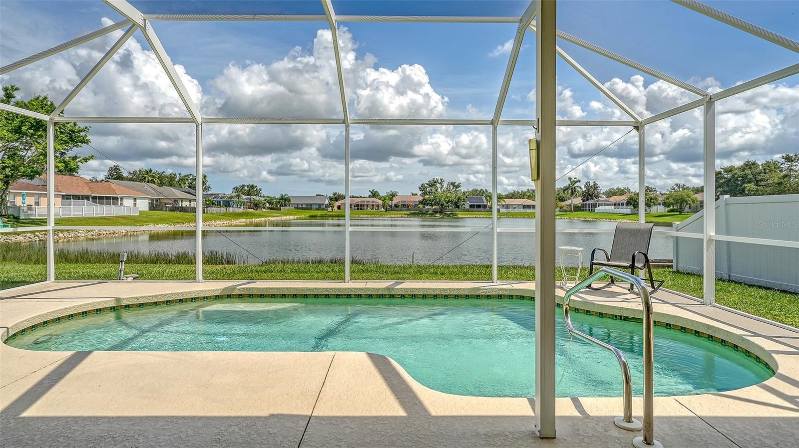 Turnkey Furnished Pool Home with Stunning Lake Views!
This beautifully maintained 3-bedroom, 2-bathroom home with an additional office, study, or den is being offered for the first time. Boasting just under 2,100 sq. ft. of flexible living space, this home is perfect for those seeking comfort, style, and peace of mind—all in one.
Features You'll Love:
Open-concept layout with lake and pool views from multiple living areas
Spacious primary suite with en suite bath, walk-in closet, and serene water views.
Lovely kitchen with solid wood cabinetry, staggered countertops with bar seating, recessed lighting, and direct access to the great room—ideal for entertaining.
Engineered wood flooring in the primary bedroom, dining room, living room, and den.
Indoor laundry room with washer and dryer included.
Outdoor Oasis:
Recently replaced pool cage surrounding an in-ground pool with a generous deck and covered patio area.
Tranquil backyard with lake frontage, offering added privacy and peaceful water views.
Upgrades & Extras:
Newer roof, screened front patio,
AC system serviced bi-annually,
Ring doorbell system, irrigation system, and plantation shutters throughout.
Sold turnkey furnished—just bring your toothbrush and suitcase!
Whether you're looking for a seasonal getaway or a full-time residence, this move-in-ready home delivers comfort, convenience, and a picture-perfect Florida lifestyle. PS dog lovers, fences are allowed.
Schedule your private showing today—this one won’t last!