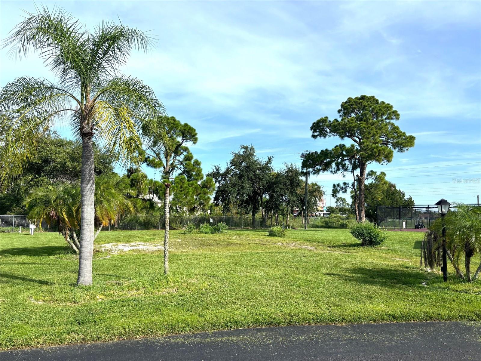 Vacant lot in a vibrant 55+ community! La Casa offers the ultimate Florida lifestyle. We have 974 homes nestled among a variety of native trees with spacious common grounds surrounding our eight lakes. Located between Sarasota and Fort Myers, this is a boater's dream with access to the Gulf of Mexico. It is convenient for shopping, sightseeing, golfing, fishing, and boating, as well as all the culture and elegance the Southwest Florida area is noted for. La Casa may have the best pools in the area. Our crown jewel is an extremely large, 40 X 60-foot swimming pool that is kept at a perfect 87 degrees. Our smaller 20 x 40 pool is quietly nestled between the clubhouse and the Activity Building. Both pools have adjacent hot tubs which are ideal for soaking muscles that are tired from golfing or tennis. Wireless Internet (Wi-Fi) is available at the Clubhouse, Activity Building, and Recreation Hall area where these pools & spas are located, so you can catch some rays while you catch up on your email! Sound enticing? Come for a visit to this self-contained oasis and see for yourself why La Casa is the ultimate destination for both snowbirds and year-round residents!