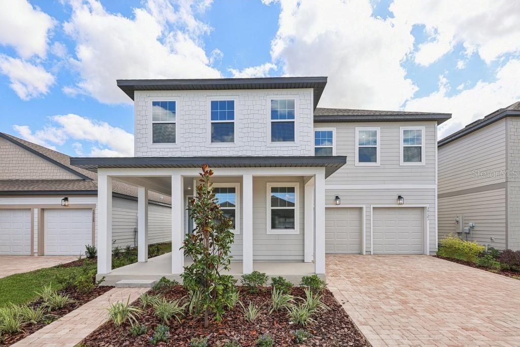 The Moseley II, inspired by our Milan Collection, showcases thoughtful design and modern style throughout its spacious layout. This two-story home features 3 bedrooms, 2.5 baths, a study, and a loft, offering plenty of flexible living space. The open-concept kitchen is beautifully appointed with 42” neutral-colored cabinets, stainless steel appliances, a large island with upgraded quartz countertops, and overlooks a stunning family room with soaring 20-foot ceilings.
The main living areas feature wood-look luxury vinyl plank flooring, while the bedrooms are finished with upgraded carpet for added comfort. Enjoy community amenities including a resort-style pool, clubhouse, and playground, all just minutes from top-rated schools and the quaint downtown streets of Mount Dora, known for its charming shops and local dining.