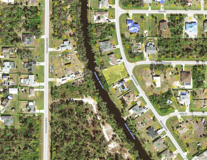 This Wooded Canal-Front Lot offers a Perfect Option to Build Your Dream Home. In the Desired X Flood Zone, this Lot provides Ample Space for Your Future Pool and Waterfront Fishing Dock. This Location is near Manasota and Boca Grande Beaches as well as Historic Downtown Dearborn Street - Englewood, Farmers Markets are just minutes away!! Nature enthusiasts will Delight in the Excellent Kayaking Opportunities Provided by the nearby Canals. With No HOA and No Deed Restrictions !! Ample Space for Parking Your Boat or Trailer right in Your Own Backyard. Don't Miss Out on this Rare Opportunity to Create Your Waterfront Haven in the Heart of Port Charlotte. Welcome to Your Paradise in Port Charlotte !! Priced to Sell !!Partially wooded CANAL LOT PORT CHARLOTTE "Fantastic opportunity! This lot is located in the beautiful community of Port Charlotte with canal access. Perfect for building your dream home in a serene environment. With easy water access, It is ideal for boating enthusiasts and outdoor activities. Don't miss out on being part of this Community.