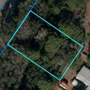 Wooded buildable lot in Williston, sandy soil for great drainage, on a paved road and some new build construction nearby