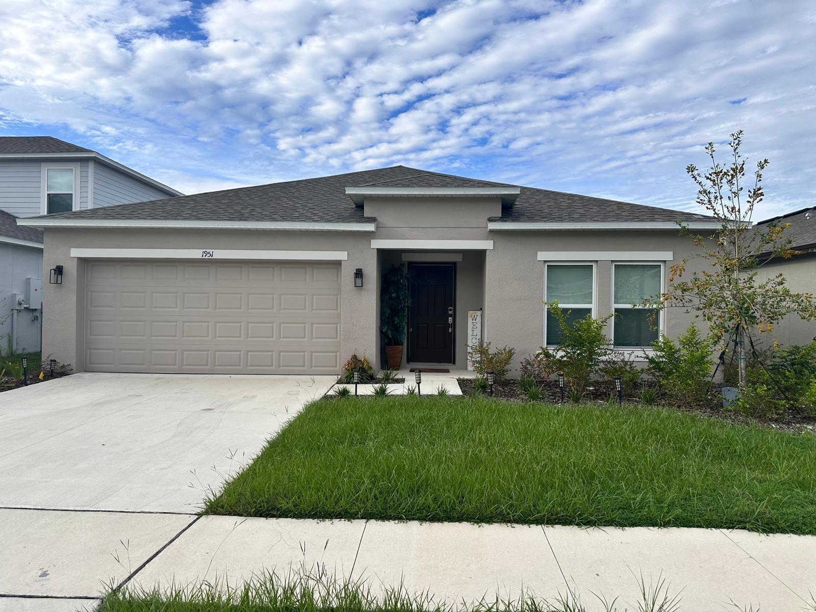 FOR LEASE - Welcome to this beautifully designed 4-bedroom, 2-bathroom home located in the desirable Ironwood community of North Lakeland. Built in 2025, this contemporary residence offers 1,974 sq. ft. of thoughtfully planned living space, ideal for modern lifestyles.
Step inside to discover an open-concept layout featuring a spacious great room that seamlessly flows into a stylish kitchen and casual dining area. The kitchen boasts a distinctive L-shaped countertop, providing ample workspace and a modern aesthetic. Adjacent to the kitchen is a versatile flex space, perfect for a home office, playroom, or additional living area.
The private primary suite is thoughtfully separated from the secondary bedrooms, offering a peaceful retreat. It includes a walk-in closet and a well-appointed en-suite bathroom. The additional bedrooms are generously sized, each with its own walk-in closet, providing ample storage.
Enjoy the convenience of an indoor laundry room, a two-car garage, and an irrigation system for easy lawn maintenance. The home is situated on a 6,250 sq. ft. lot, offering a manageable yard space.
Pet Policy: Pets allowed with restrictions: 2 small/medium pets allowed (up to 65 lbs. No large dogs or aggressive breeds). $500 non-refundable pet fee required. Tenant responsible for any additional damages caused by pets. Please inquire with landlord for more details.
Located just minutes from I-4, this home provides easy access to both Tampa and Orlando, making commuting a breeze. Nearby amenities include shopping centers, dining options, and recreational parks, ensuring everything you need is within reach.
Don’t miss the opportunity to make this stunning home your own. Schedule a showing today!