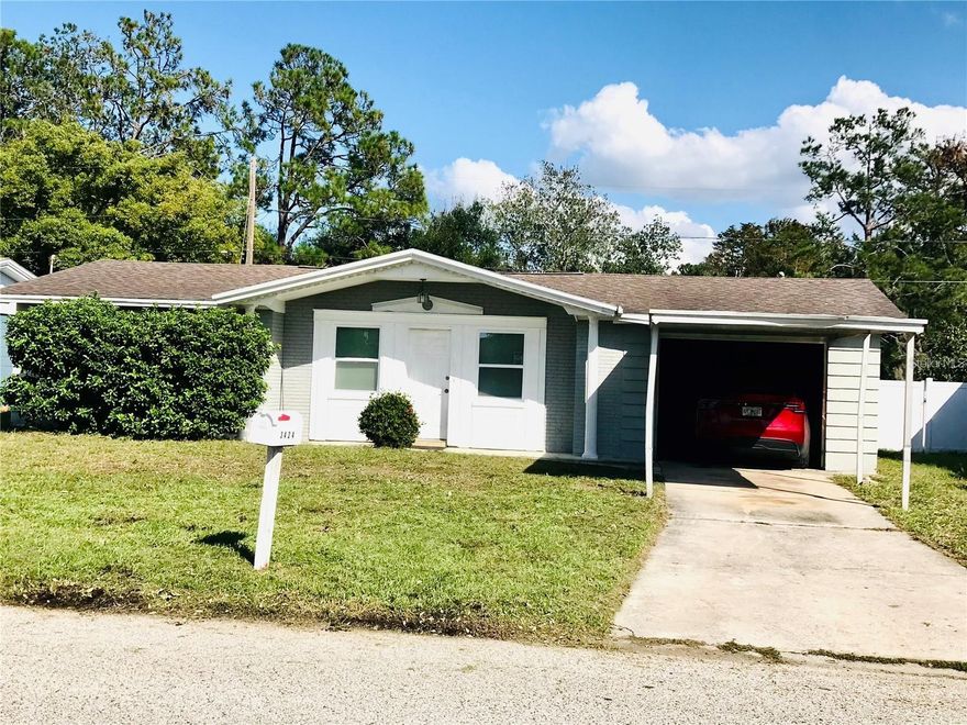 Great Deal!!! A MUST SEE!!  Very NICE 2 Bedrooms, 1.5 Bathrooms with a Large Screened Porch, 1 Car Garage & 1 Carport 1-Story HOUSE on a HUGE Back Yard. Recently Remodeled: Just Freshly Painted the Floor of the Car Garage; Recently Painted inside and outside; Electric Box was Replaced 2 years ago; All Windows (except one in the bathroom) had replaced 3 years ago; Brand-New Garage Door Opener was Installed 4 years ago; Beautiful Ceramic Tile Floors Laid down throughout about 4 years ago, ... Nice Kitchen adjacent to the Sliding Door has Granite Counter-Tops, Wood Cabinets, Stainless-Steel Sinks, Newer Faucet, Pantry and Space for Dining Table. Spacious Living Room with 2 windows. Both Bedrooms with decent size have beautiful Tile Flooring and both have 2 windows. The Full Bathroom is inside of the house, and a Half Bathroom is in the Garage. Big Back Porch screened-in is very comfortable to sit and relax with your family over-looking the huge backyard and even far to the Pond. The over-sized Garage with Washer & Dryer Hook-up. Close to US-19 with all kinds of businesses; convenient for going Shopping, Restaurants, Hospitals, various Parks and Recreation and bodies of Water including the Gulf of Mexico, Anclote River; Key Vista Park, Howard Park Beach, Sunset Beach and Historical Tarpon Springs! Please CALL Today for more info and Schedule a showing!