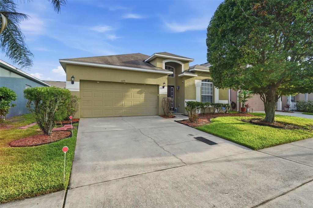 Photo of 1676 Canoe Creek Falls Drive, Orlando, FL 32824 (MLS # O6407938)