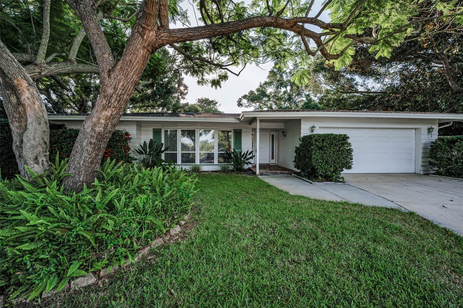 Welcome to 1172 Glenmoor Ct! This charming and move-in-ready 4-bedroom, 2-bathroom home is nestled on a quiet cul-de-sac in the desirable Morningside Estates. This well-maintained property boasts a bright, open layout with large windows and wood flooring that flows throughout the main living areas. The kitchen features white cabinetry, solid-surface countertops, and a convenient breakfast bar perfect for casual dining or entertaining. Just off the kitchen, the spacious family room opens to a covered patio area—ideal for indoor-outdoor Florida living. Enjoy natural light streaming through the expansive sliding glass doors and floor-to-ceiling windows, giving views of the lush, private yard. The split-bedroom layout offers privacy and flexibility, making it great for families or guests. Residents of Morningside Estates can live an active lifestyle in more ways than one! Enjoy a discounted recreation card to the state of the art Morningside Recreation Center! With a full playground, basketball and tennis courts, a fitness center, pool and more, you have everything you need to improve your mental and physical well-being. Located close to top-rated schools, parks, beaches, shopping, and dining; this home blends comfort and convenience. Whether you're a first-time buyer or looking for space to grow, this one checks all the boxes!