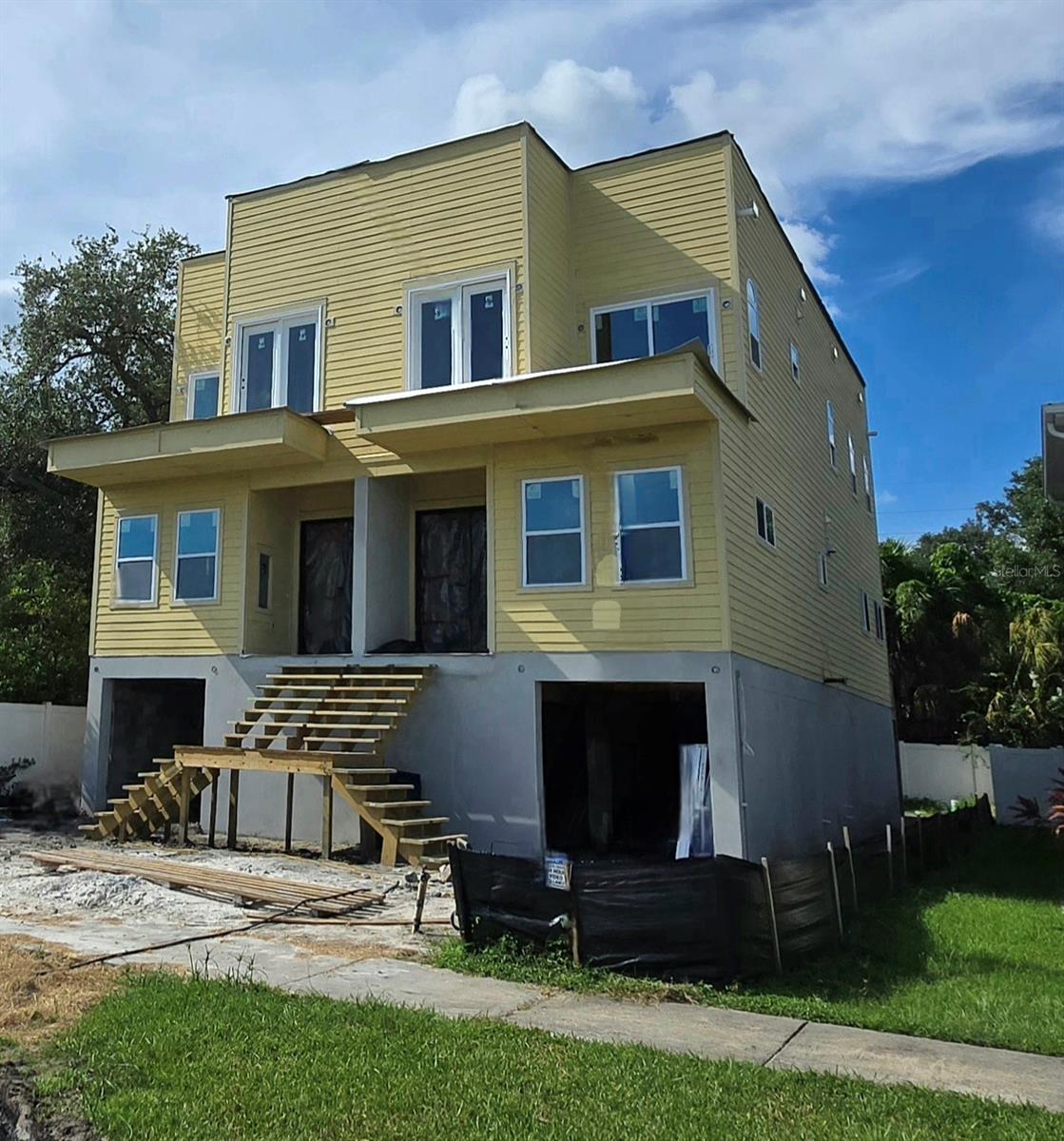 Under Construction. Can also be sold separately for $995,000 each...To be completed by March '26 and seller is offering a discount to anyone that puts down an early down payment)...These TWO one-of-a-kind TOWNHOUSES overlook DeSoto Park and McKay Bay in the heart of Tampa with EACH townhouse featuring the following: 2,050 sq. feet of living space, FOUR bedrooms, an office/flex room, TWO FULL BATHROOMS, plus a half-bath...Each unit even comes with its own elevator!...All the floors will be primarily marble and each unit will have multiple balconies (with exact rendering in pictures) including unobstructed views of the aforementioned McKay Bay and DeSoto Park...Each garage will come with electric car charging stations...The ground floor is built based on new city of Tampa requirements for FEMA and each column (32 total) provide 20 foot piling to withstand any potential flooding or hurricanes down the line...Also comes with an elevation certificate approval from the city of Tampa which will provide a significant homeowners insurance discount...There will also be 12 foot rods all around the walls to handle any hurricane...All windows and doors are Hurricane proof...Breakaway walls between columns will provide safe environments during heavy storms...None of the houses adjacent to this property have ever been flooded but after last year's Hurricanes The City of Tampa construction requirements have changed and these properties have been built accordingly.