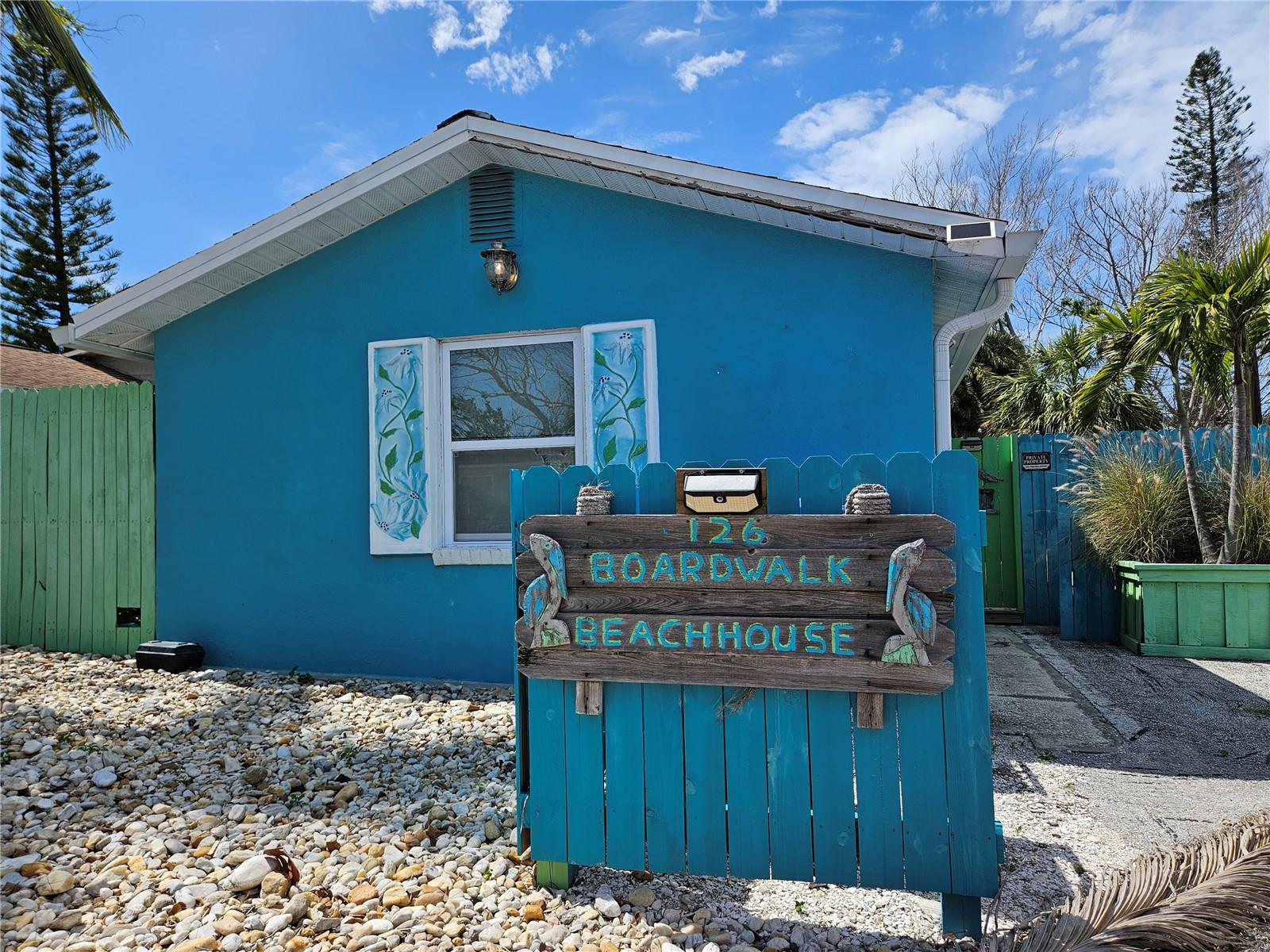 LOCATION LOCATION LOCATION! This is your opportunity to own this beach life home in a rarely available neighborhood that is only 1 block wide so you can enjoy all the water activities from any direction out your front door. It is only a few houses West to the lighted crosswalk on Gulf Blvd. taking you to the Boardwalk and the beautiful Treasure Island Beach. A few doors to the East and you are fishing the Intercoastal (known to many fisherman as "The Kitchen"). Each avenue offers access to the intercoastal with fishing or a boat ramp only a few blocks up. This floorplan features 2 ensuite baths, (one for each bedroom), a galley kitchen, and access to the backyard from the primary bedroom with an outside (surfboard) shower. The backyard is fully fenced with a pergola on the patio for sitting and sipping in the shade and a large deck to the side (closer to the kitchen) to place your grill. Park a few cars here with the driveway and rocked, xeroscaped front yard. The neighborhood also offers guest (paid) parking opportunities for hosting larger groups of friends and family. Walk or bike to numerous shopping and dining favorites in Treasure Island and Johns Pass. Take the Beachfront Boardwalk to enjoy roller blading, the best views to walk off dinner or get your exercise in without sand in your shoes but with the water in your view. This home did sustain flooding from Hurricane Helene and much has been removed but the granite countertop was left for savings to the buyer. Buyers to perform due diligence on renovations or intended use. Home is being sold AS-IS.
BEACHFRONT SUNSETS ARE ONLY A FEW MINUTES WALK AWAY, MAKE IT YOUR NORM.