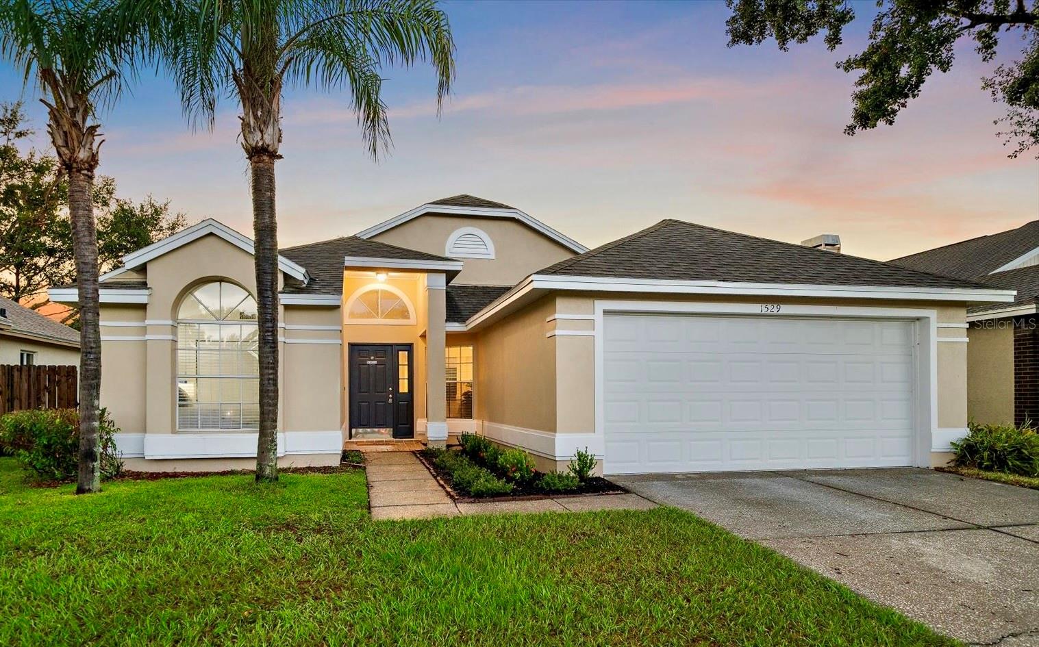 NEW ROOF TO BE INSTALLED PRIOR TO CLOSING!!! Welcome to your move-in ready dream home in Providence Estates! Featuring magnificently high ceilings and a wide split floor plan, this home provides the perfect balance of space and functionality for year round living and hosting your friends and family. With multiple sweeping living spaces that open to your kitchen, dining area, and screened lanai, you'll become the go-to spot for holiday celebrations, family gatherings, and super bowl parties! The open layout and windows throughout the home provide sweeping natural light, complimented by the modern styling of the interior finishings. Newer stainless steel appliances, luxury flooring, remodeled bathrooms, and fresh paint elevate the home's feel and functionality. Space throughout the home is maximized as evident with the large bedrooms, walk-in master closet, and two car garage. Beyond all the magnificent features of the inside, you'll still love spending time outside in your screened lanai and fully fenced yard. Between the home's fantastic curb appeal, wide open interior spaces, and ultra private backyard, this home has it all!!