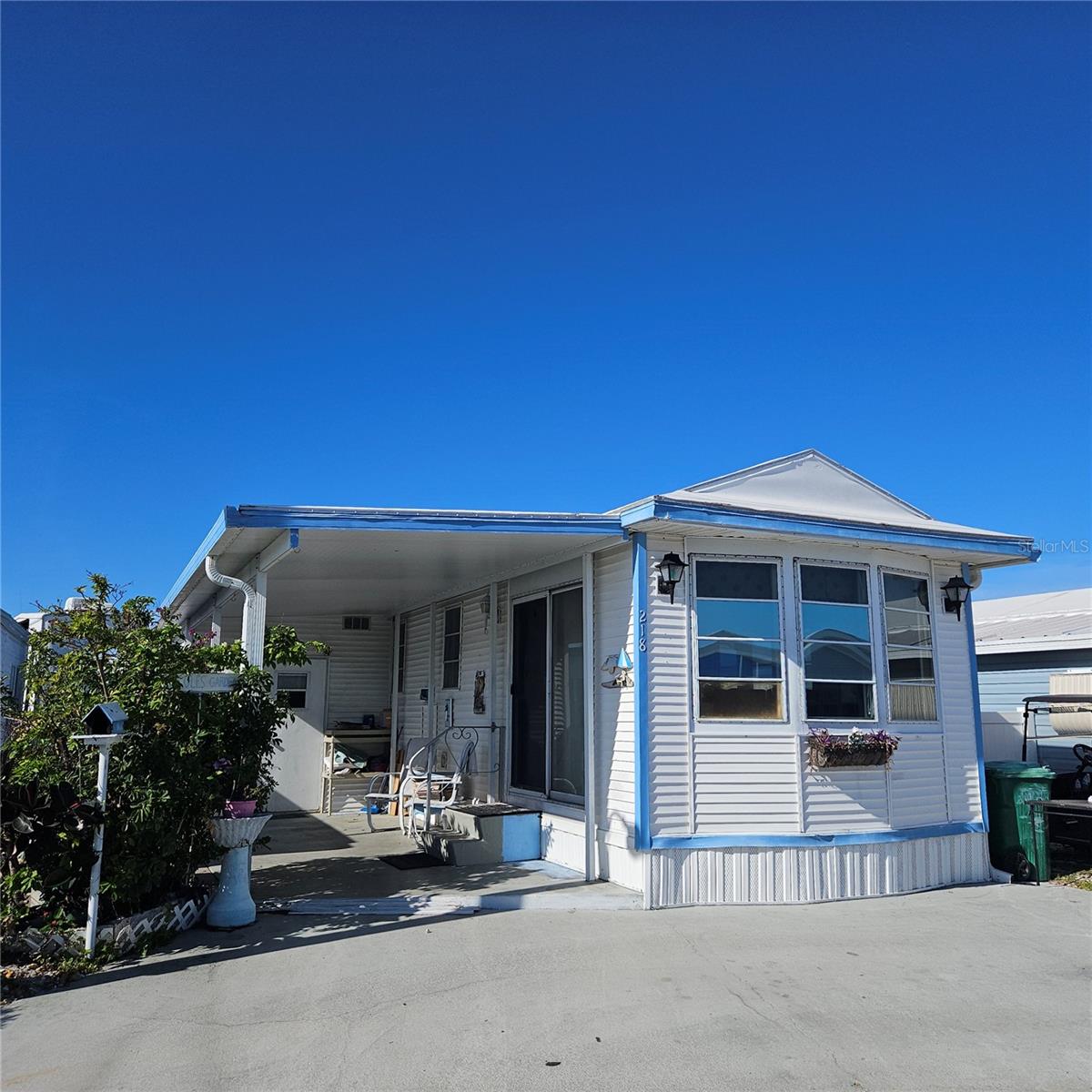 Why spend the winter freezing and shoveling snow when you can spend a few months enjoying the Florida Sunshine! Only $65,000 gets you this 1994 two bedroom/one bath manufactured home where YOU OWN THE LOT! Holiday Travel Park is an amenity-rich "over 55" community, very centrally located and just minutes to area beaches, shopping, lots of restaurants and so much more! Enjoy making new friends at the community center, which hosts all kinds of activities and events! Spend a few hours poolside, then move on to the shuffleboard courts or the bocce ball courts for a few games. Common laundry areas are provided, along with bathrooms and showers! There's also a storage area for your boat/RV onsite as well as a park and a community boat ramp, leading to a lake. Even Fido (up to 40#) is welcome here! This home has two portable AC units, a bonus room that has been used as Bedroom #2, plus a shed for some extra storage. Membrane roof was replaced in 2017. What are you waiting for - Come on down!