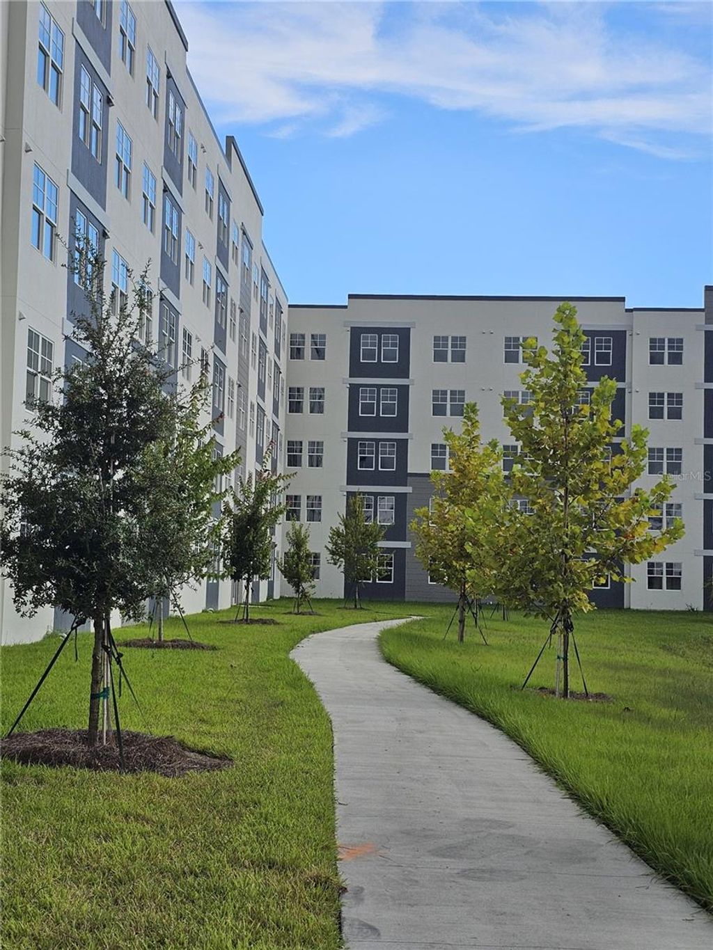 Photo of 5579 Millenia Park Boulevard #205, Orlando, FL 32839 (MLS # O6391732)