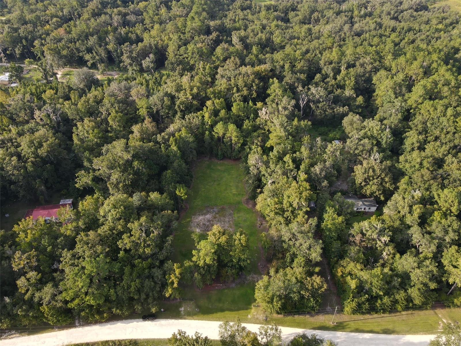 Looking to build? This 3.15acres could be the perfect canvas, partially cleared with plenty of trees for privacy, this could be the spot to build that dream mini farm or barndominium! Only 10 minutes to the WEC Ocala Jockey Club, 30 minutes to the World Equestrian Center and 30 minutes to Gainvesville. Down a quiet, no outlet road, just minutes to Sweet Dixie South, this could be your perfect start.